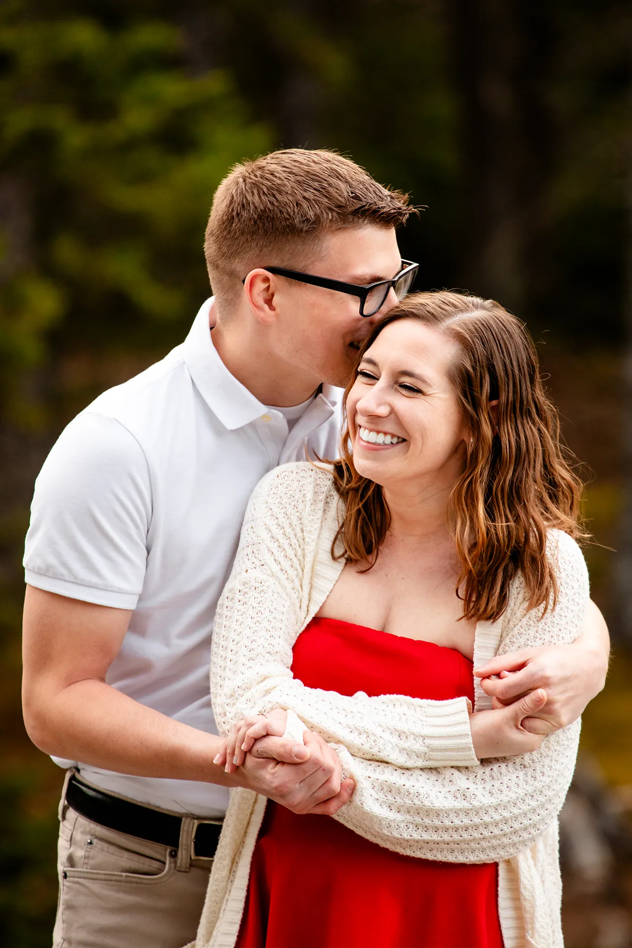 maine engagement photography chelsea mike 01 An engaged couple laughs and snuggles during an engagement session at Jordan Pond in Acadia National Park, Maine.