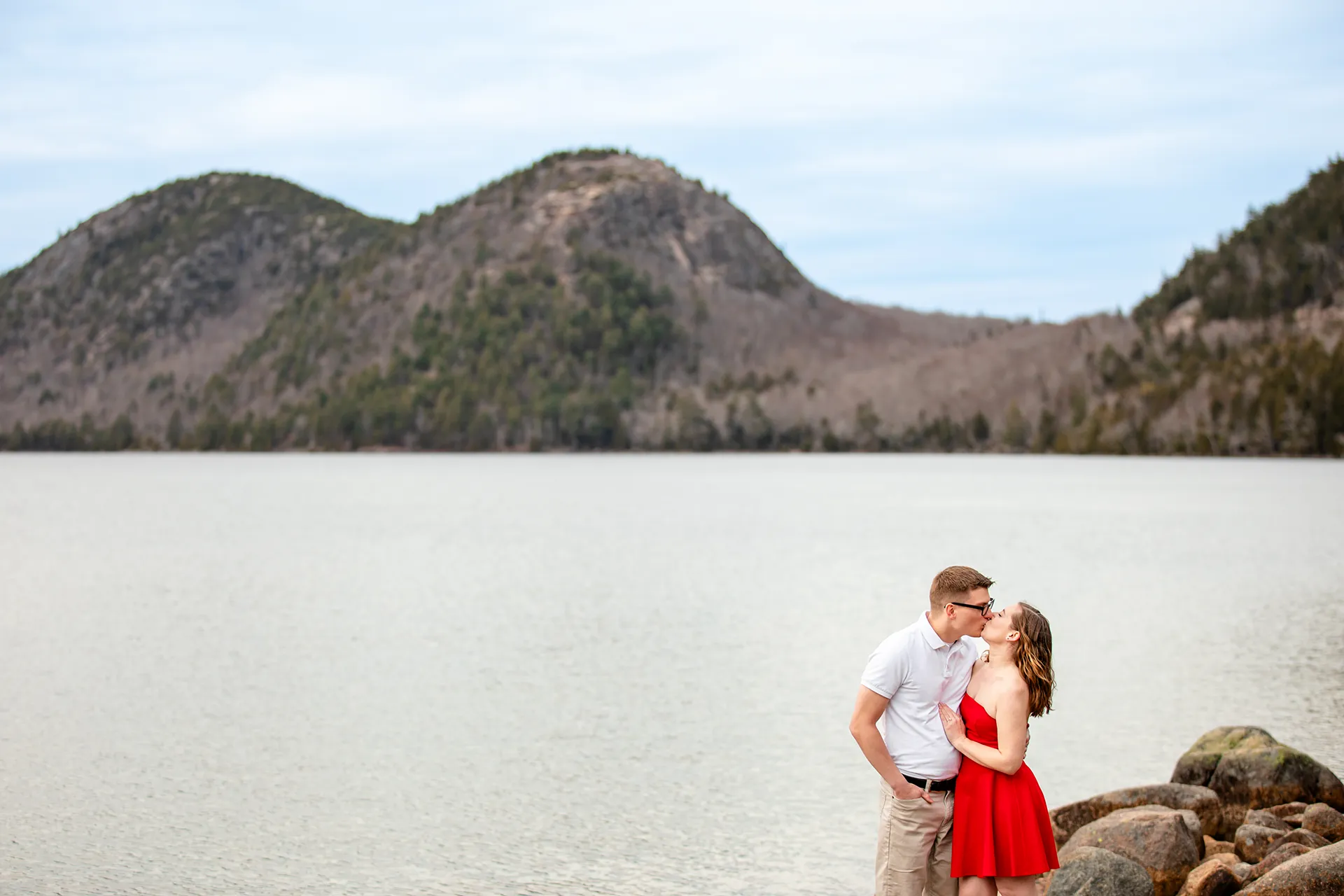 maine engagement photography chelsea mike 10 A man and woman kiss during an engagement session at Jordan Pond in Acadia National Park, Maine.