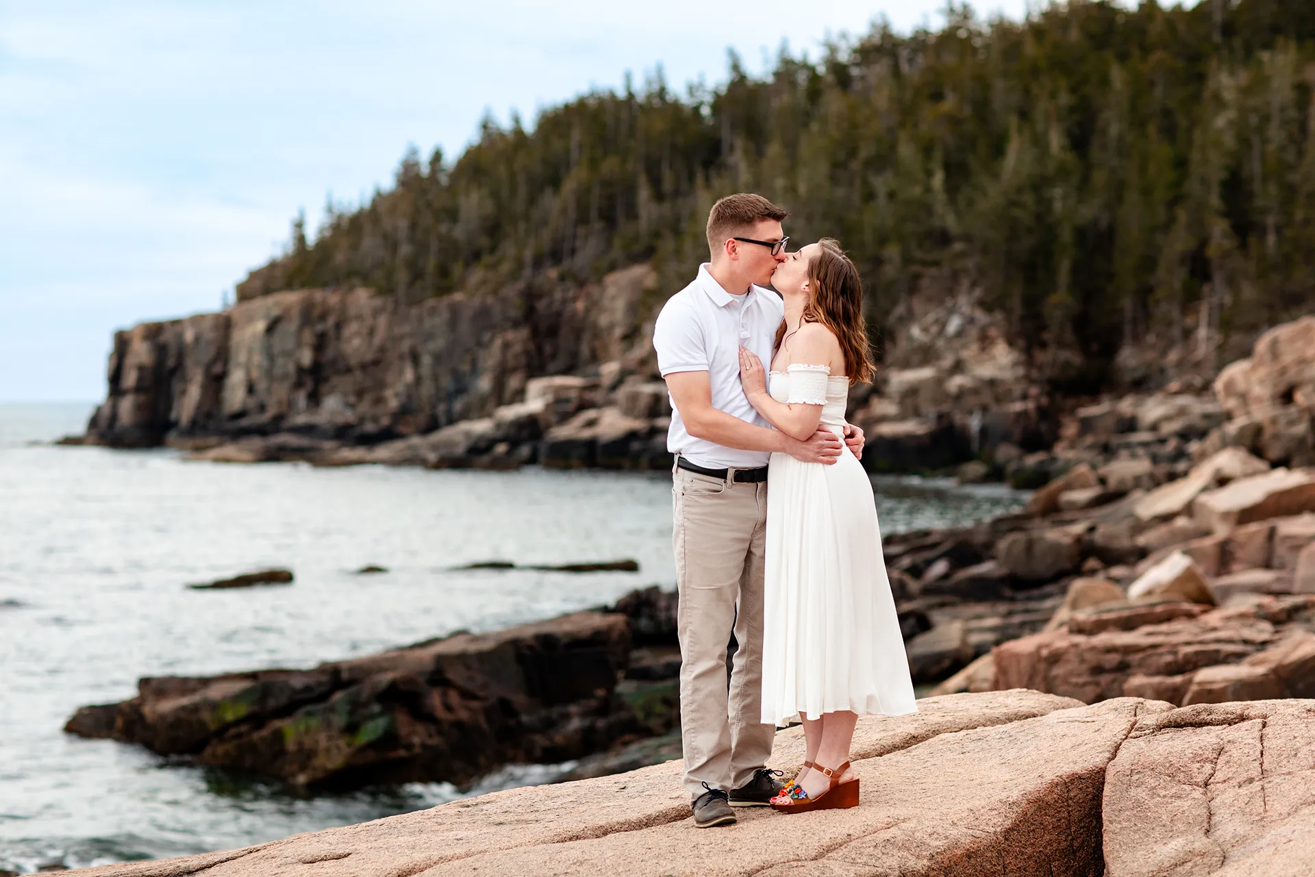 maine engagement photography chelsea mike 15 A man and woman kiss during an engagement session near Otter Cliff in Acadia National Park, Maine.