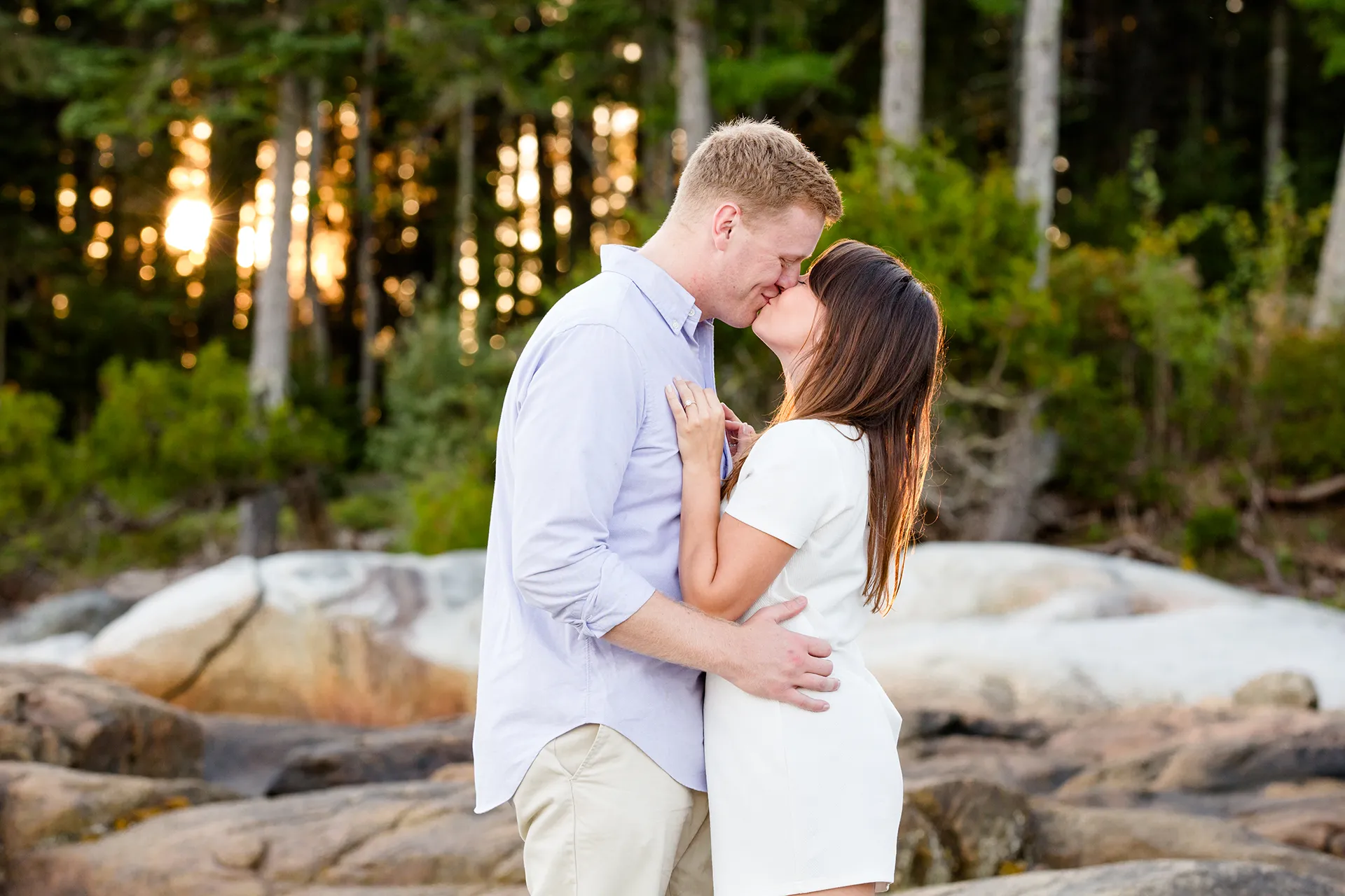 maine engagement photography stephanie nick 09 An engaged couple kiss as the sun shines during an engagement session at Curtis Cove Beach in Blue Hill, Maine.