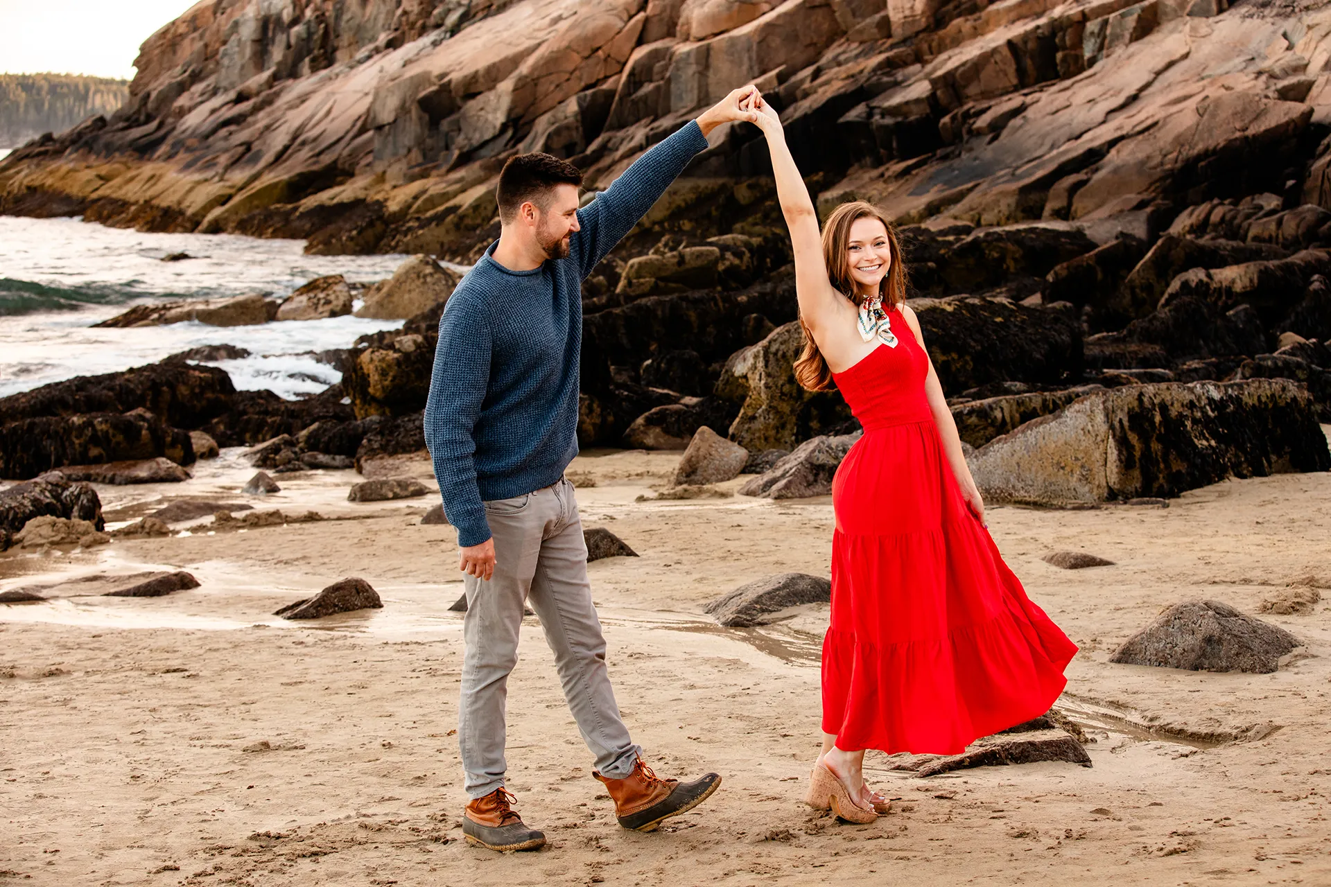 maine family photography daehler 06 A man spins a woman during a family portrait session on Sand Beach in Acadia National Park near Bar Harbor, Maine.