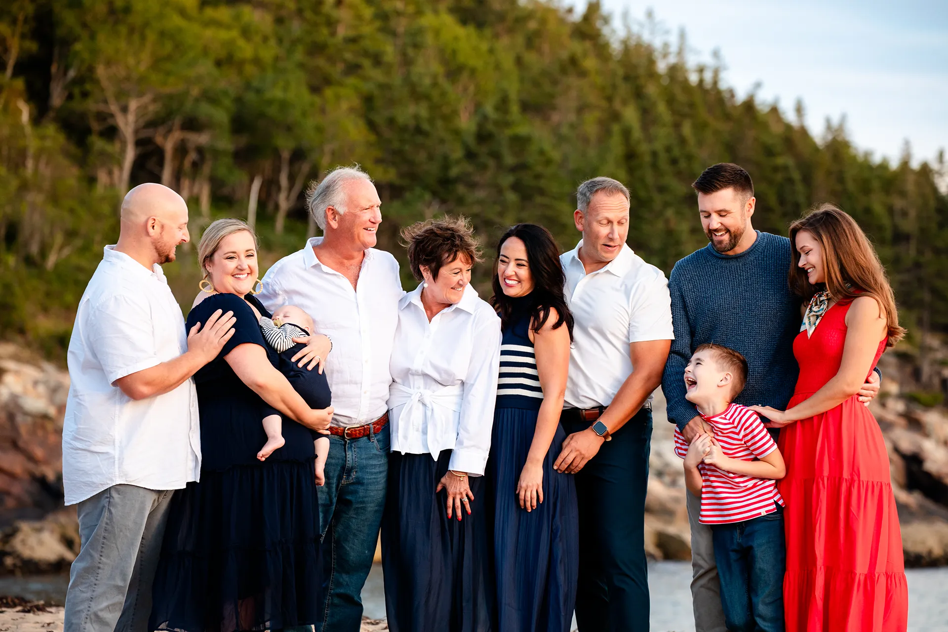 maine family photography daehler 18 An extended family laugh during a family portrait session on Sand Beach in Acadia National Park near Bar Harbor, Maine.