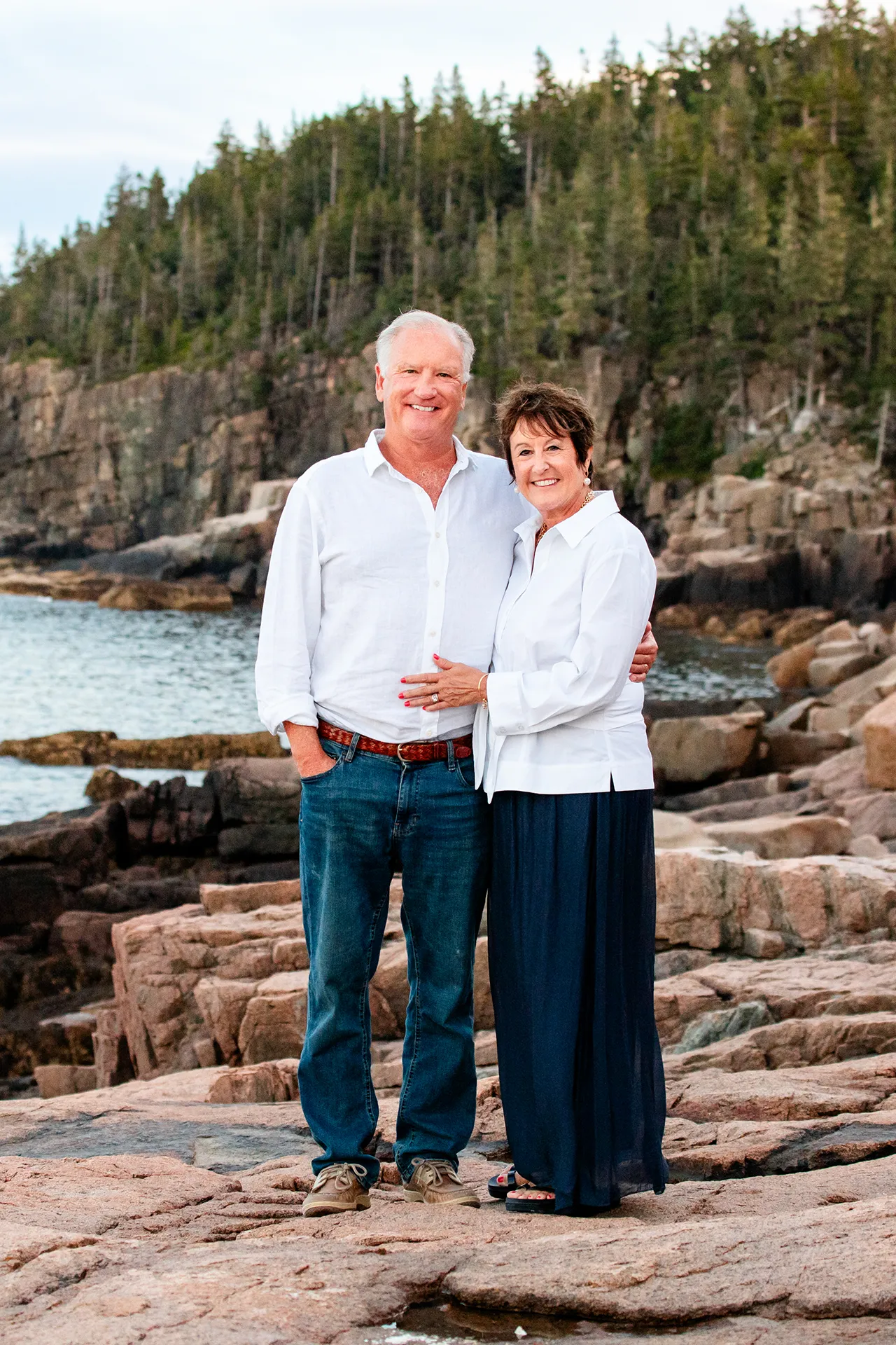 maine family photography daehler 21 A married couple smiles and poses during a family portrait session at Otter Cliff in Acadia National Park near Bar Harbor, Maine.