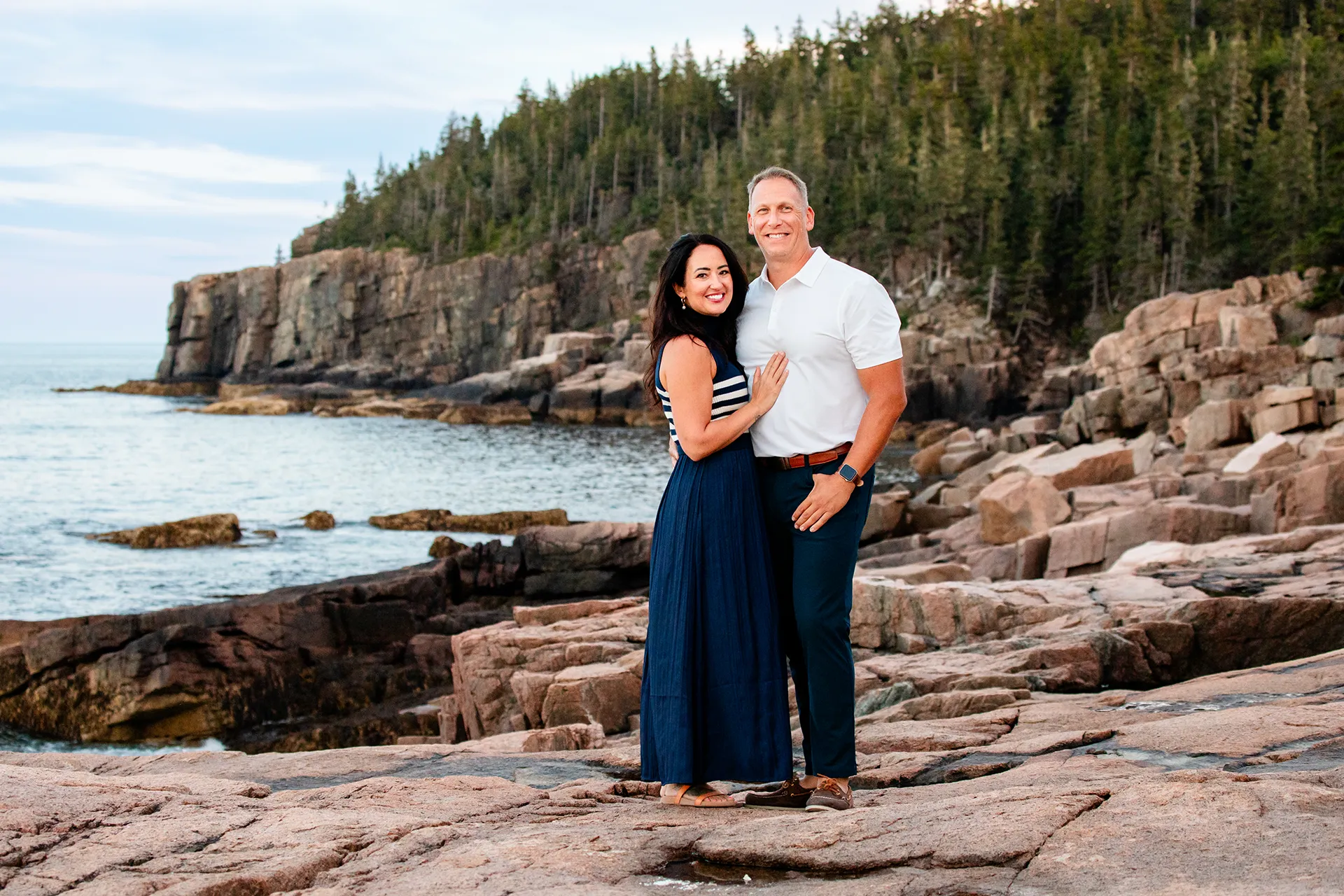 maine family photography daehler 22 A couple smiles and poses during a family portrait session at the Ocean Path Trail in Acadia National Park near Bar Harbor, Maine.