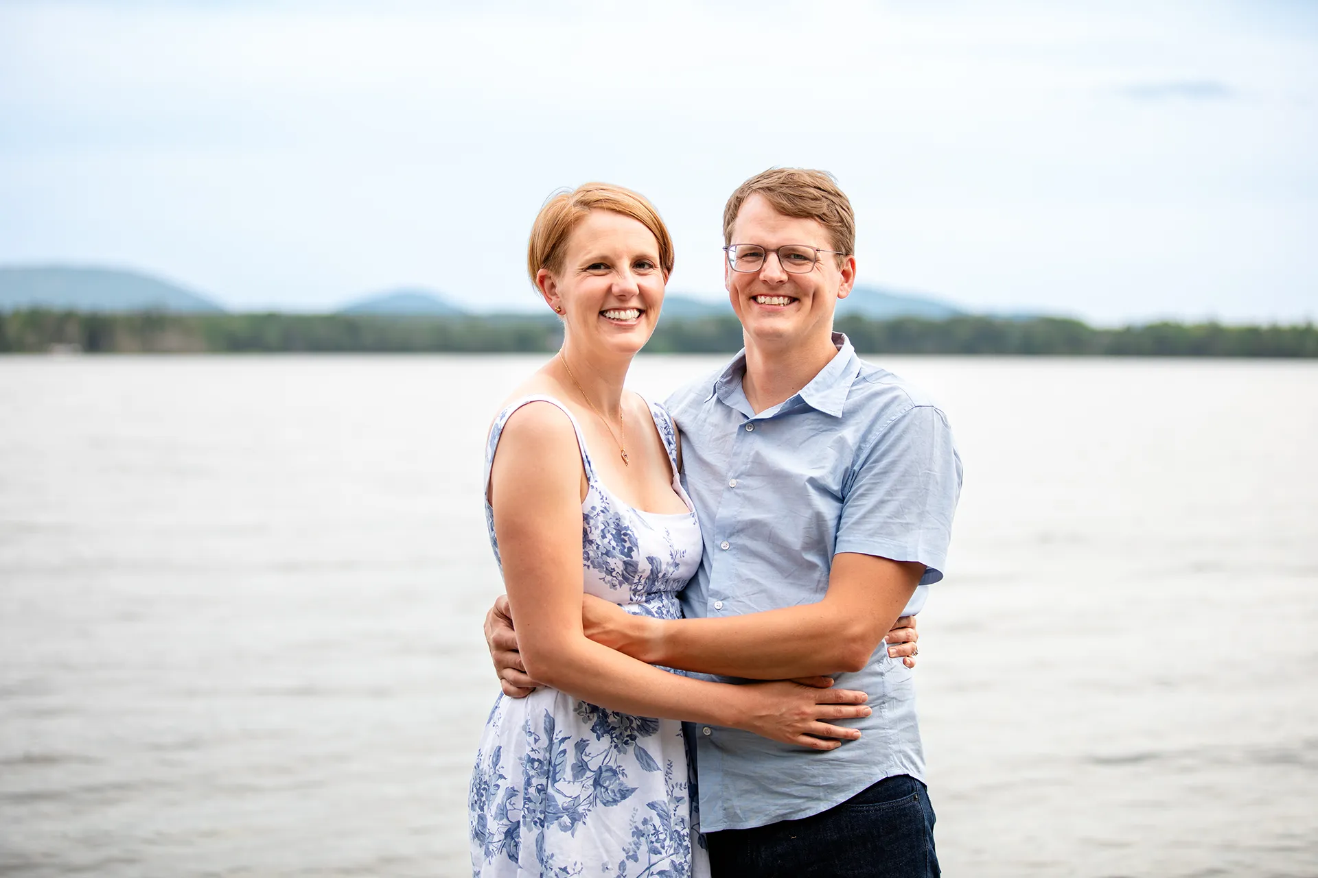 maine family photography moldawer mandsager 15 A man and woman smile and pose during a family portrait session in Lamoine, Maine.