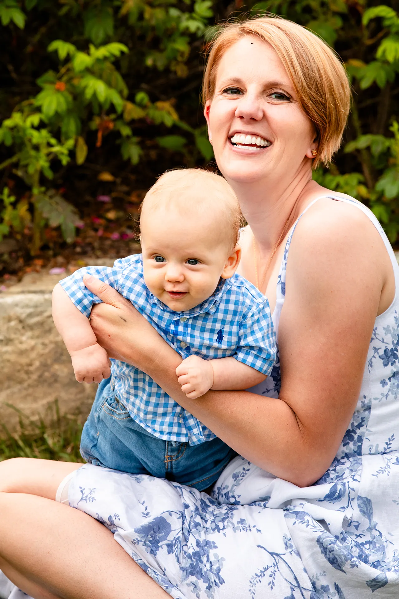 maine family photography moldawer mandsager 21 A mom holds her young son as they smile during a family portrait session in Lamoine, Maine.