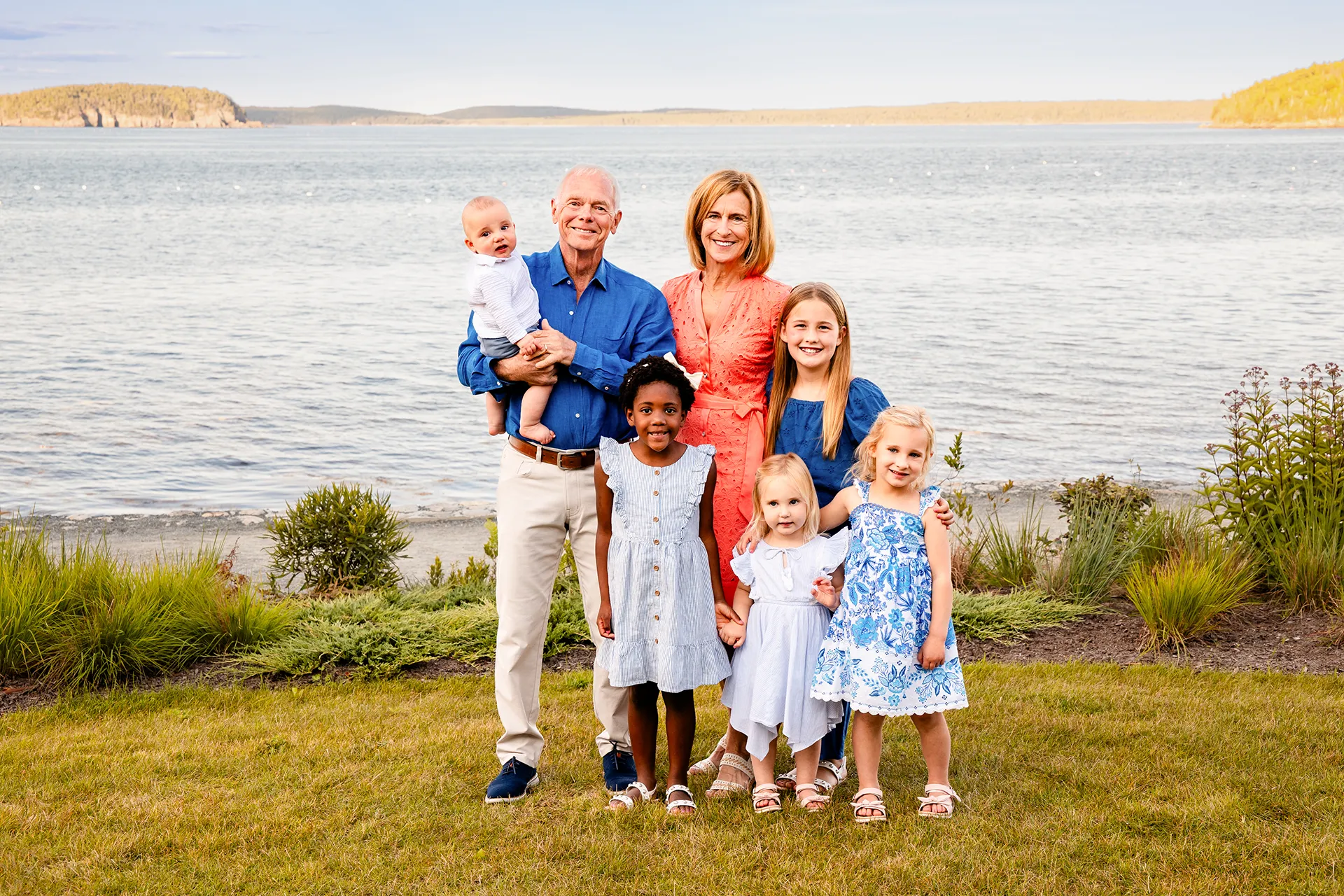 Grandparents smile and pose with grandchildren during a portrait session at the Bar Harbor Inn & Spa in Bar Harbor, Maine.
