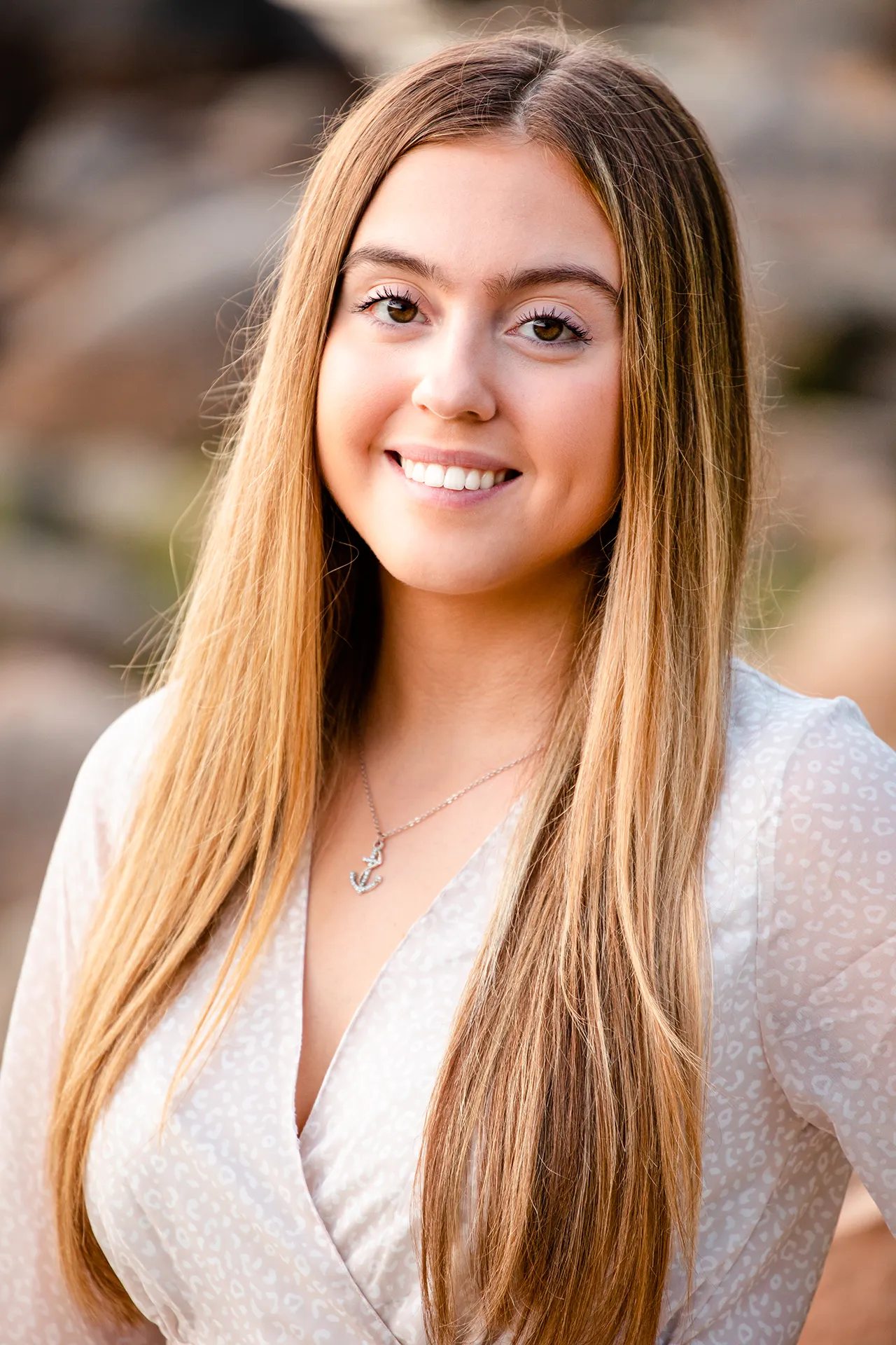 maine senior photography brooke 12 A girl smiles and poses during a senior portrait session at Jordan Pond in Acadia National Park near Bar Harbor, Maine.