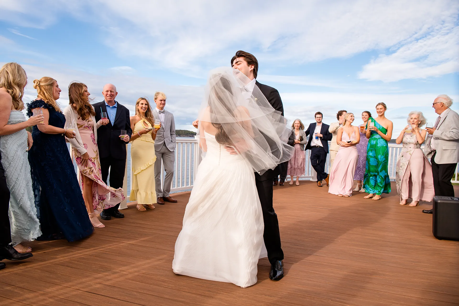 A groom laughs as he shares a first dance with a bride during a wedding reception at the Bar Harbor Inn and Spa near Acadia National Park in Maine.