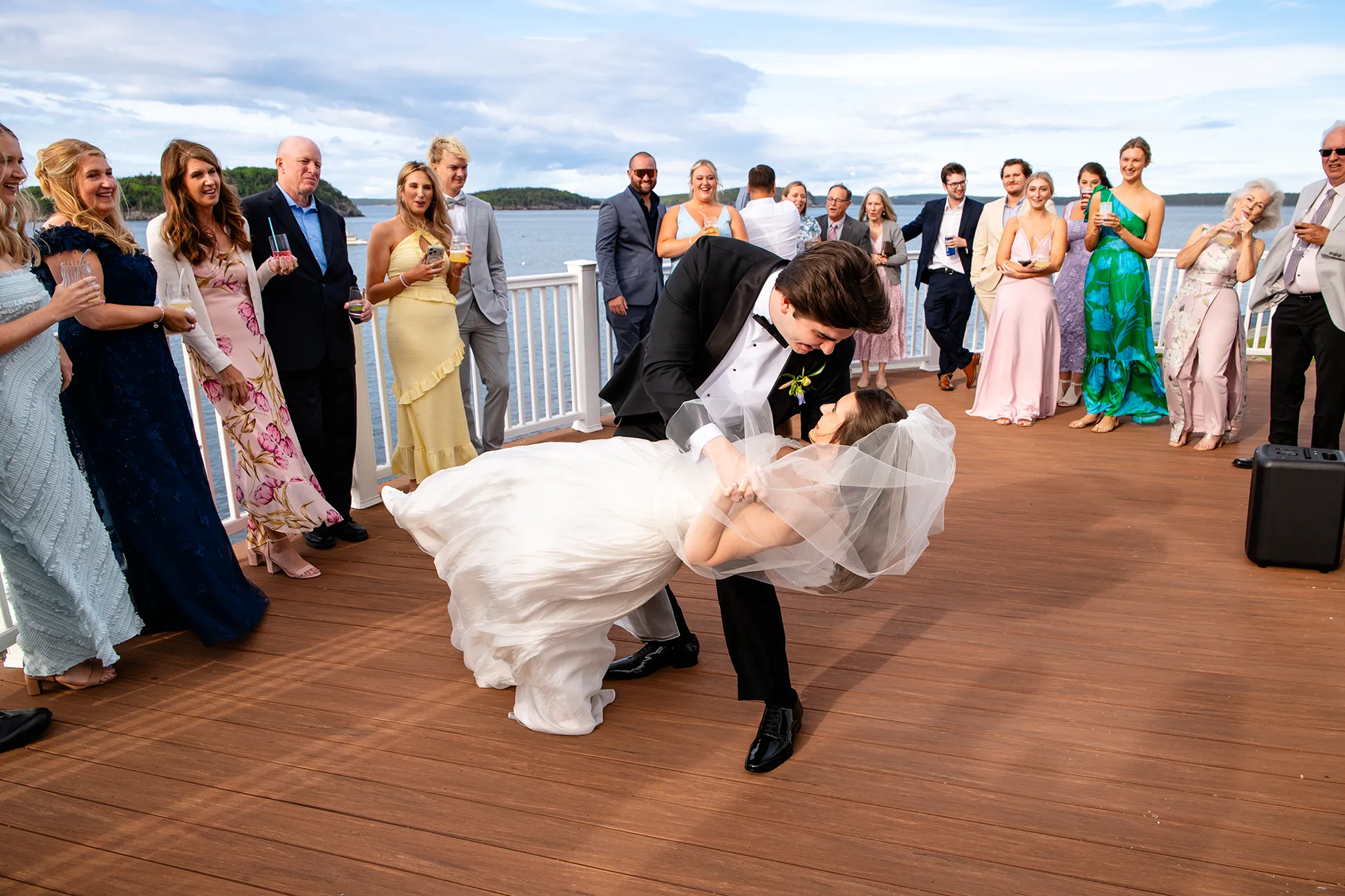 A groom dips a bride while they share a first dance during a wedding reception at the Bar Harbor Inn and Spa near Acadia National Park in Maine.
