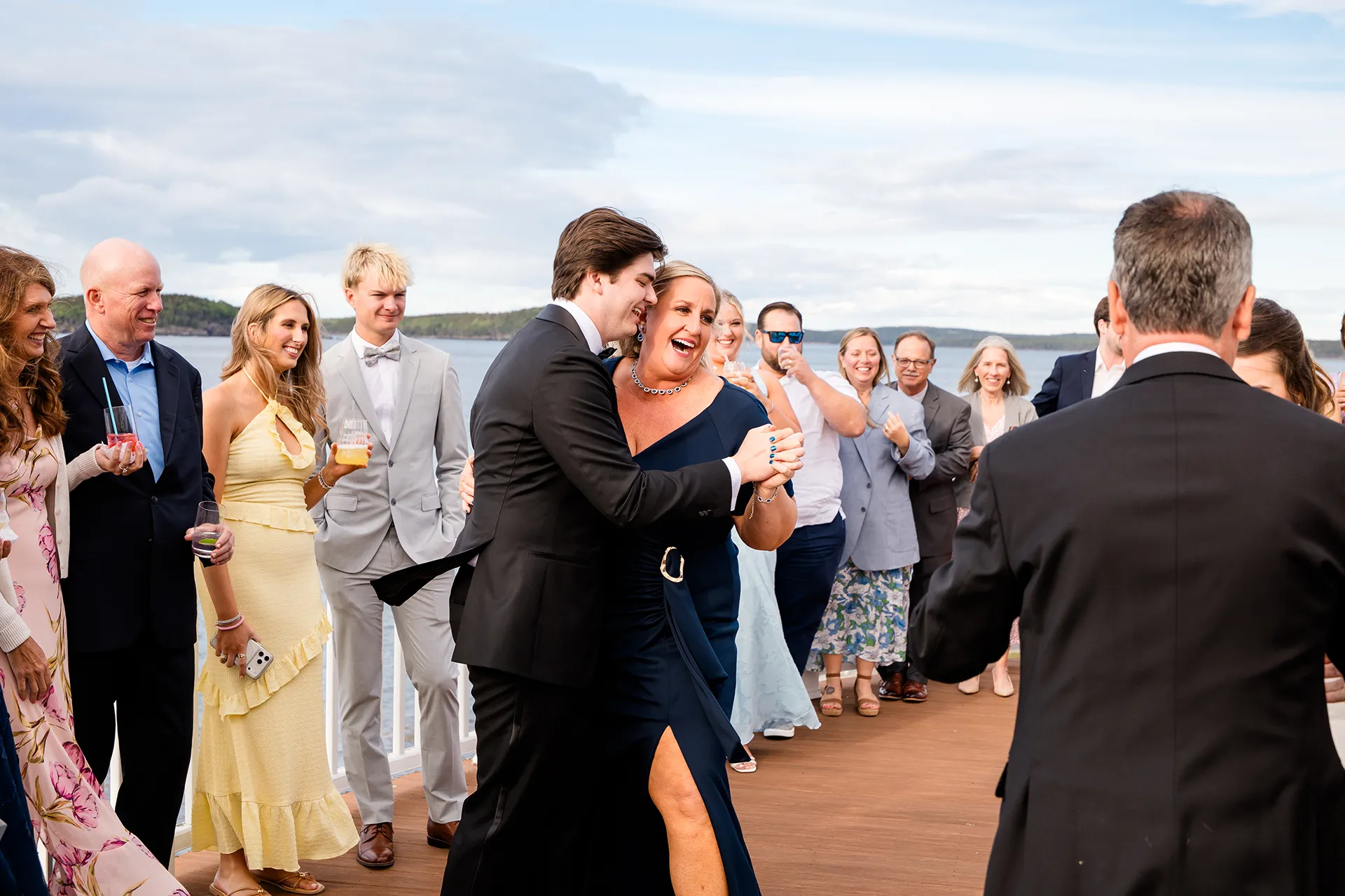 A groom and his mom laugh while they dance during a wedding reception at the Bar Harbor Inn and Spa near Acadia National Park in Maine.