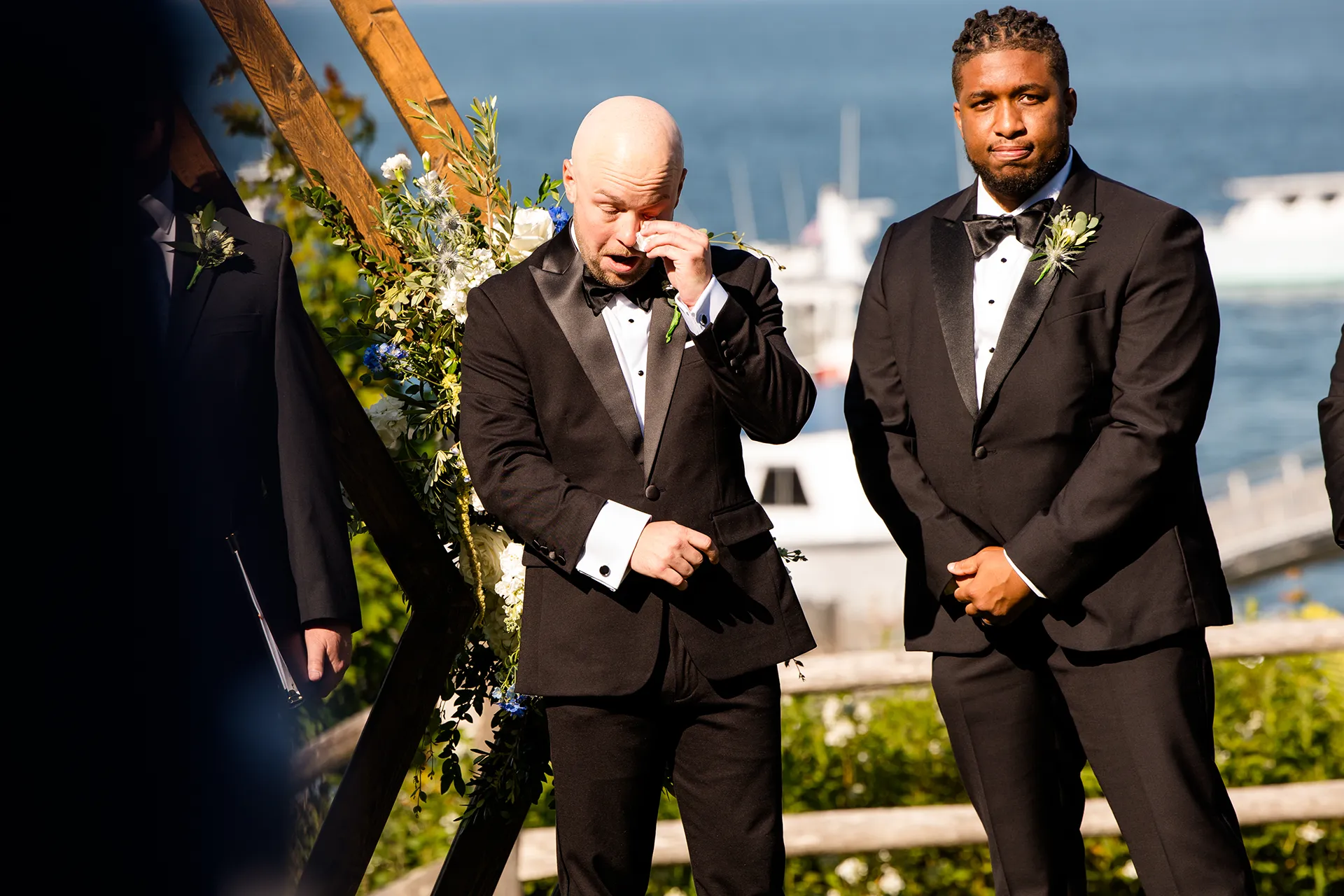 A groom cries as he watches a bride walk down the aisle during a wedding ceremony at the Atlantic Oceanside Hotel & Event Center in Bar Harbor, Maine.