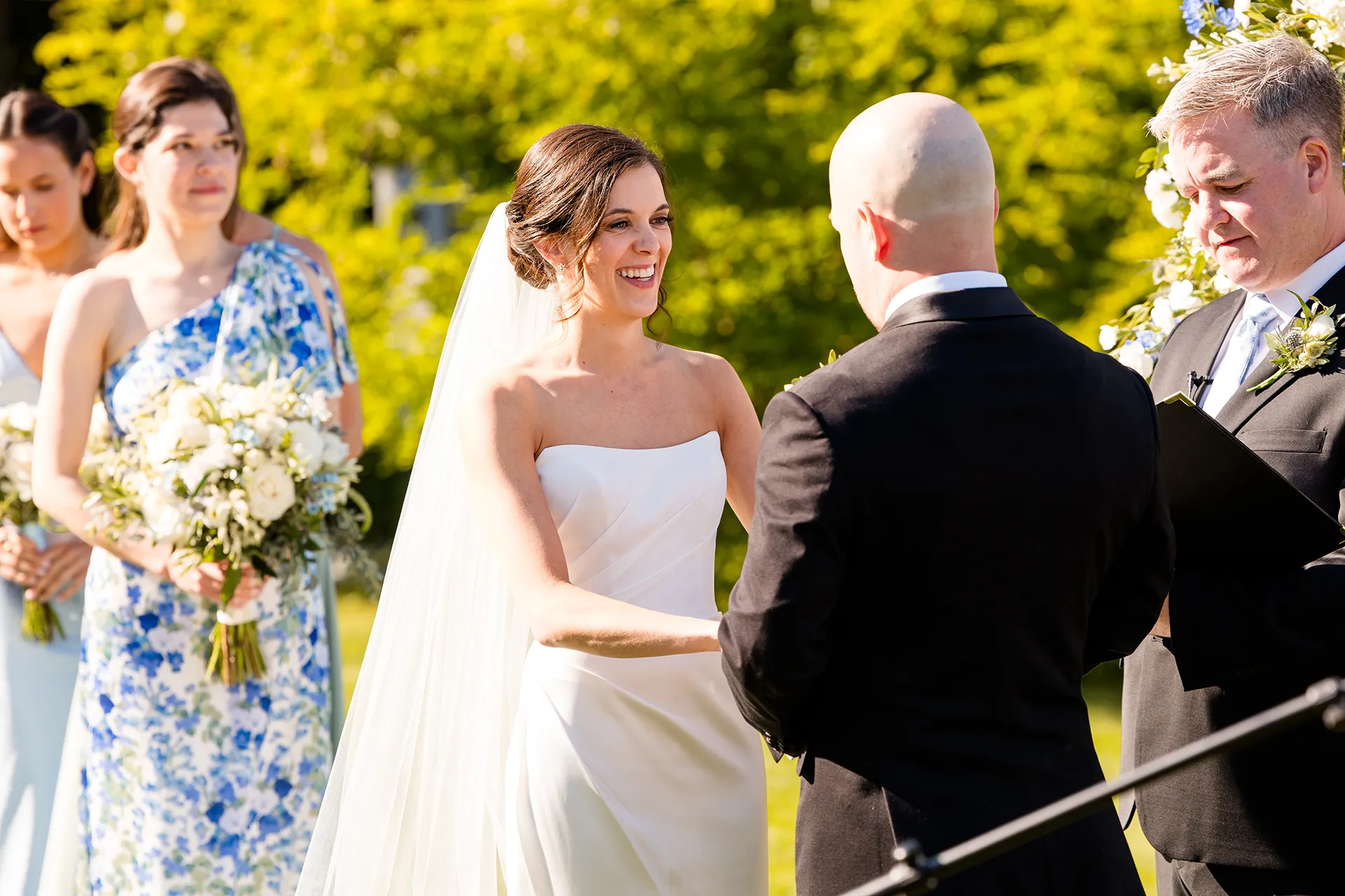 A bride laughs during a wedding ceremony at the Atlantic Oceanside Hotel & Event Center in Bar Harbor, Maine.