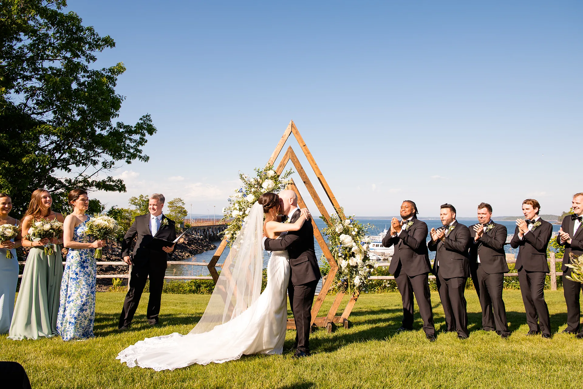 A newly married couple kiss during a wedding ceremony at the Atlantic Oceanside Hotel & Event Center in Bar Harbor, Maine.