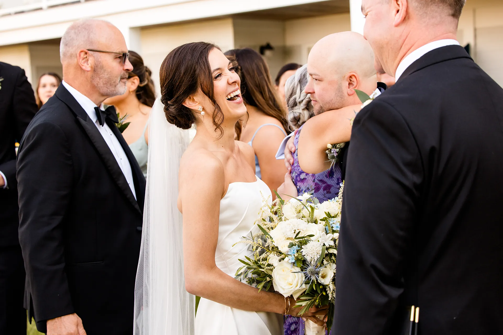A bride laughs while guests celebrate at the Atlantic Oceanside Hotel & Event Center in Bar Harbor, Maine.