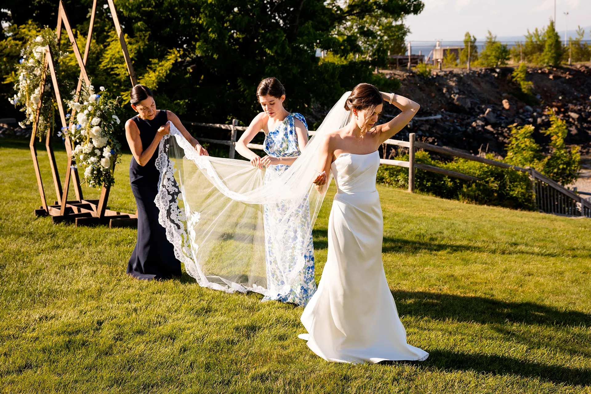 A bridesmaid and mom help a with her veil during a wedding at the Atlantic Oceanside Hotel & Event Center in Bar Harbor, Maine.