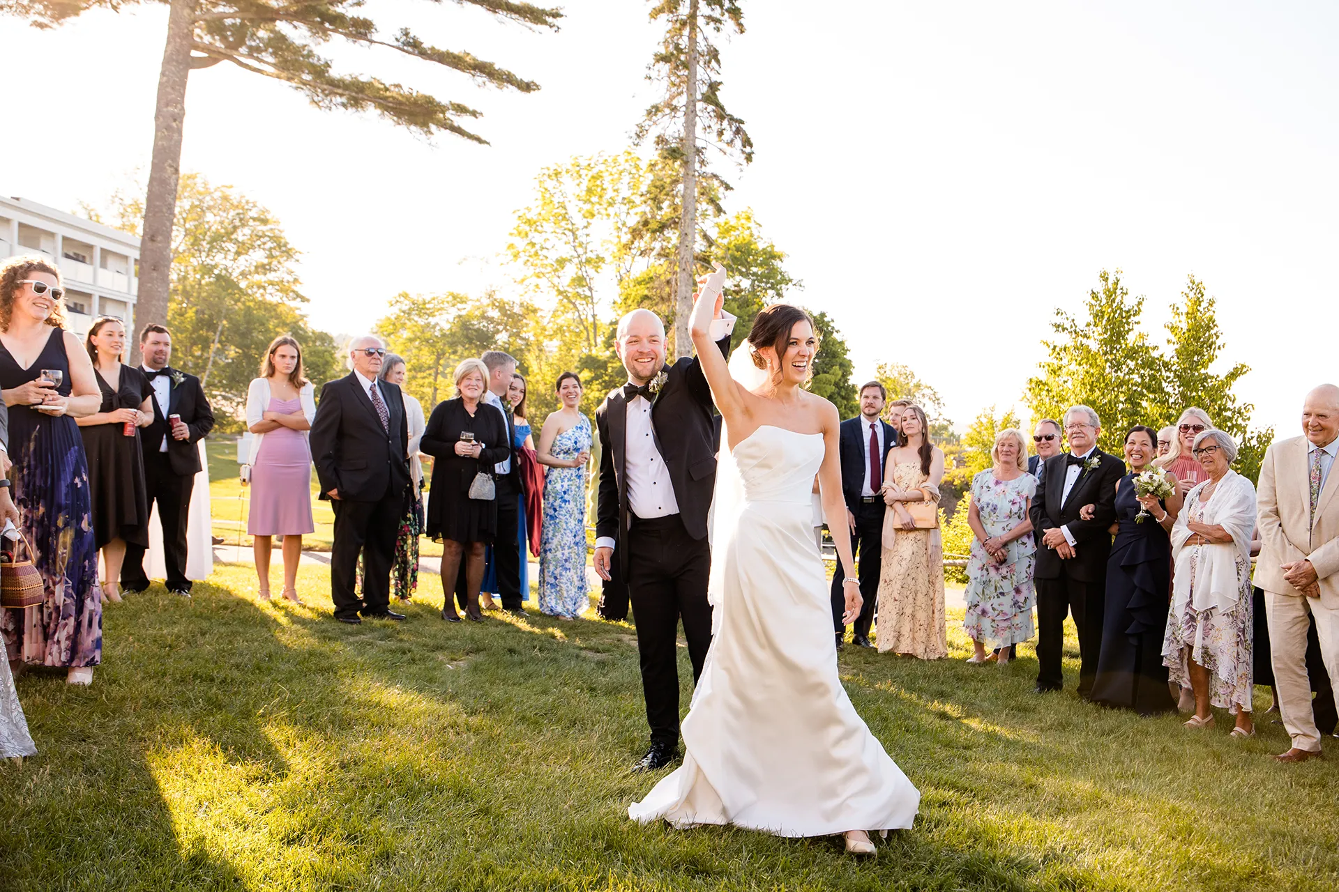 A groom spins a bride as they share a first dance outside at the Atlantic Oceanside Hotel & Event Center in Bar Harbor, Maine.