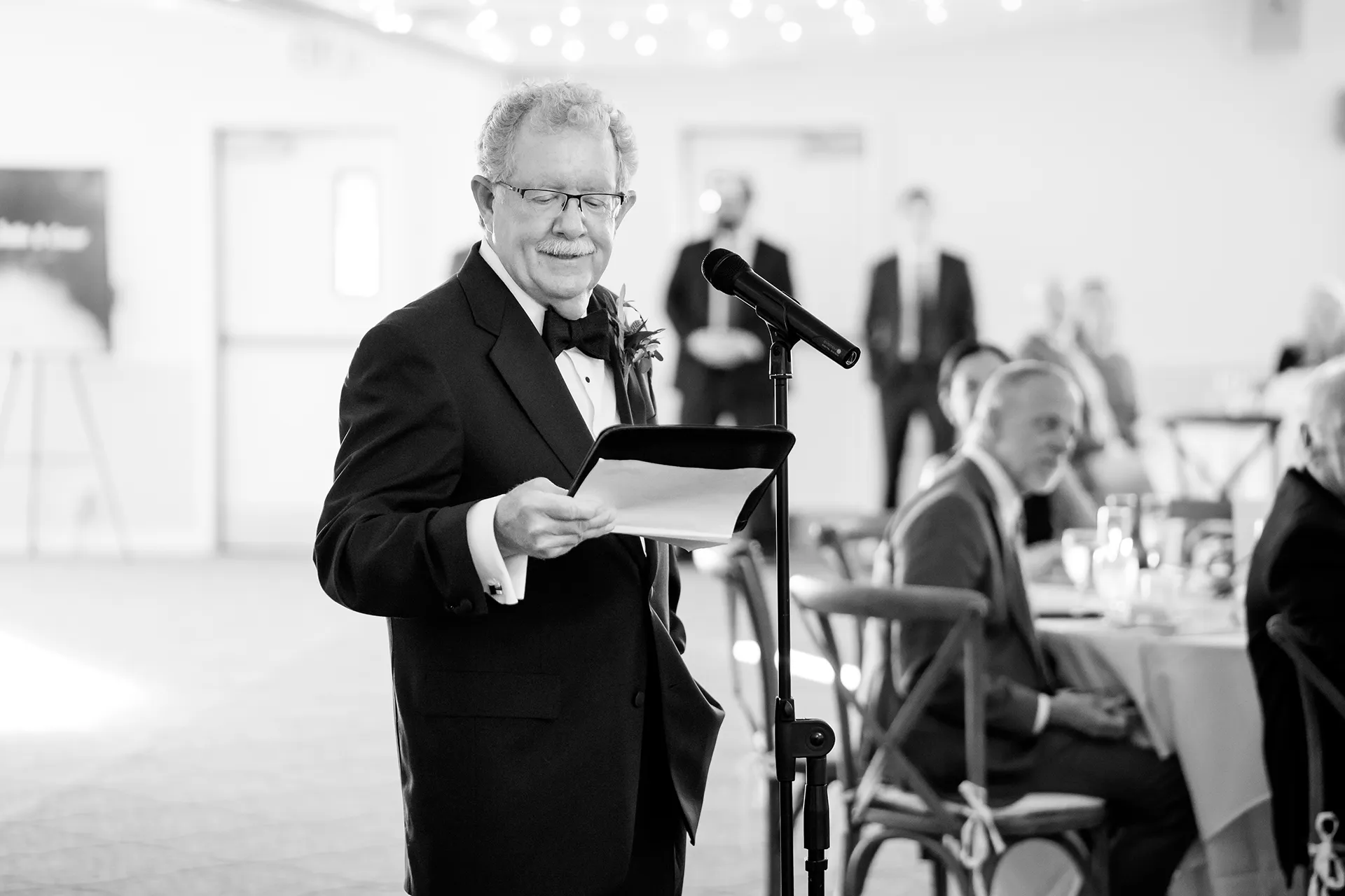 A dad gives a toast during a wedding reception at the Atlantic Oceanside Hotel & Event Center in Bar Harbor, Maine.