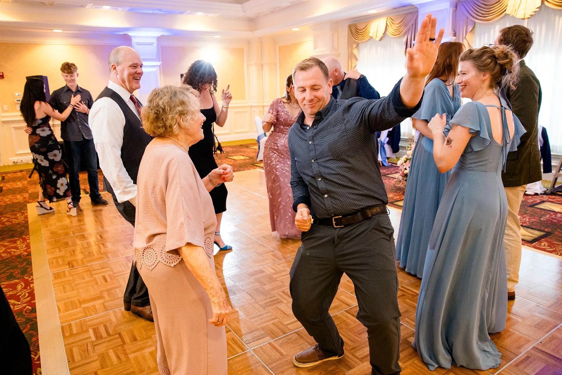 Wedding guests dance during a reception at Hilton Garden Inn in Bangor, Maine.