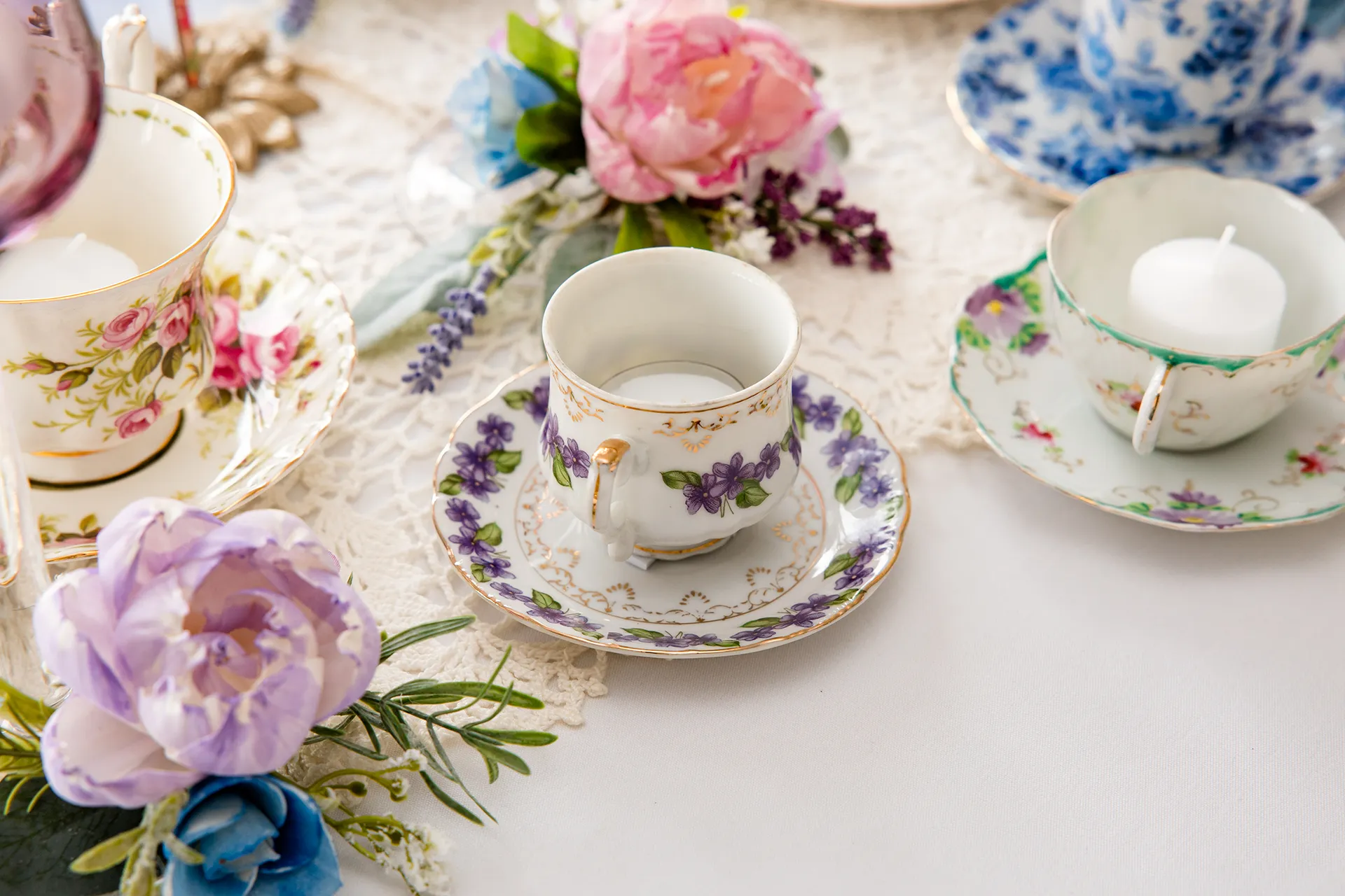 maine wedding photography bethany mike 03 A closeup of a floral cup and saucer for a garden party themed wedding at the York Harbor Reading Room in Maine.