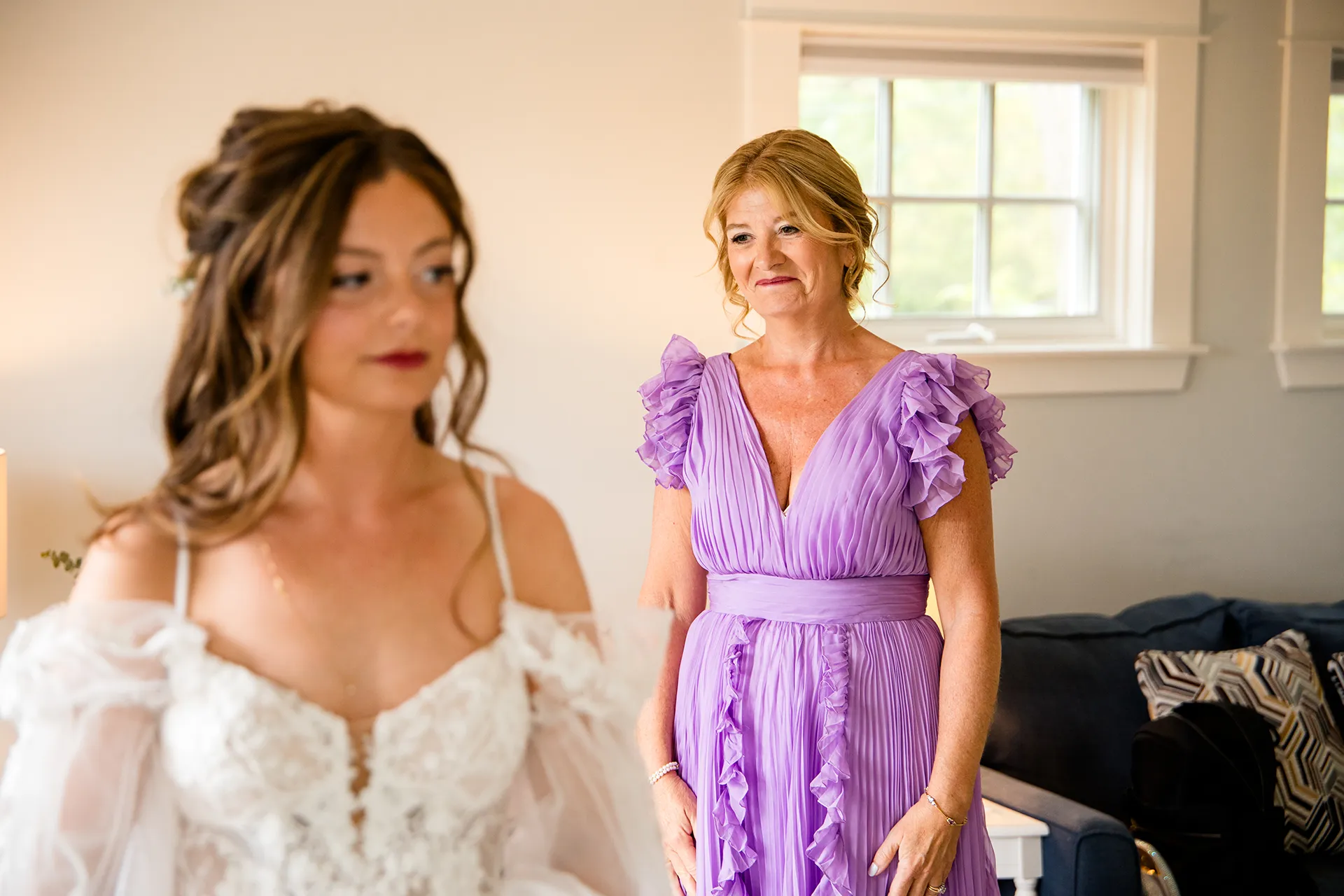 maine wedding photography bethany mike 17 A mom smiles at a bride as she gets ready for a wedding at the York Harbor Reading Room in Maine.