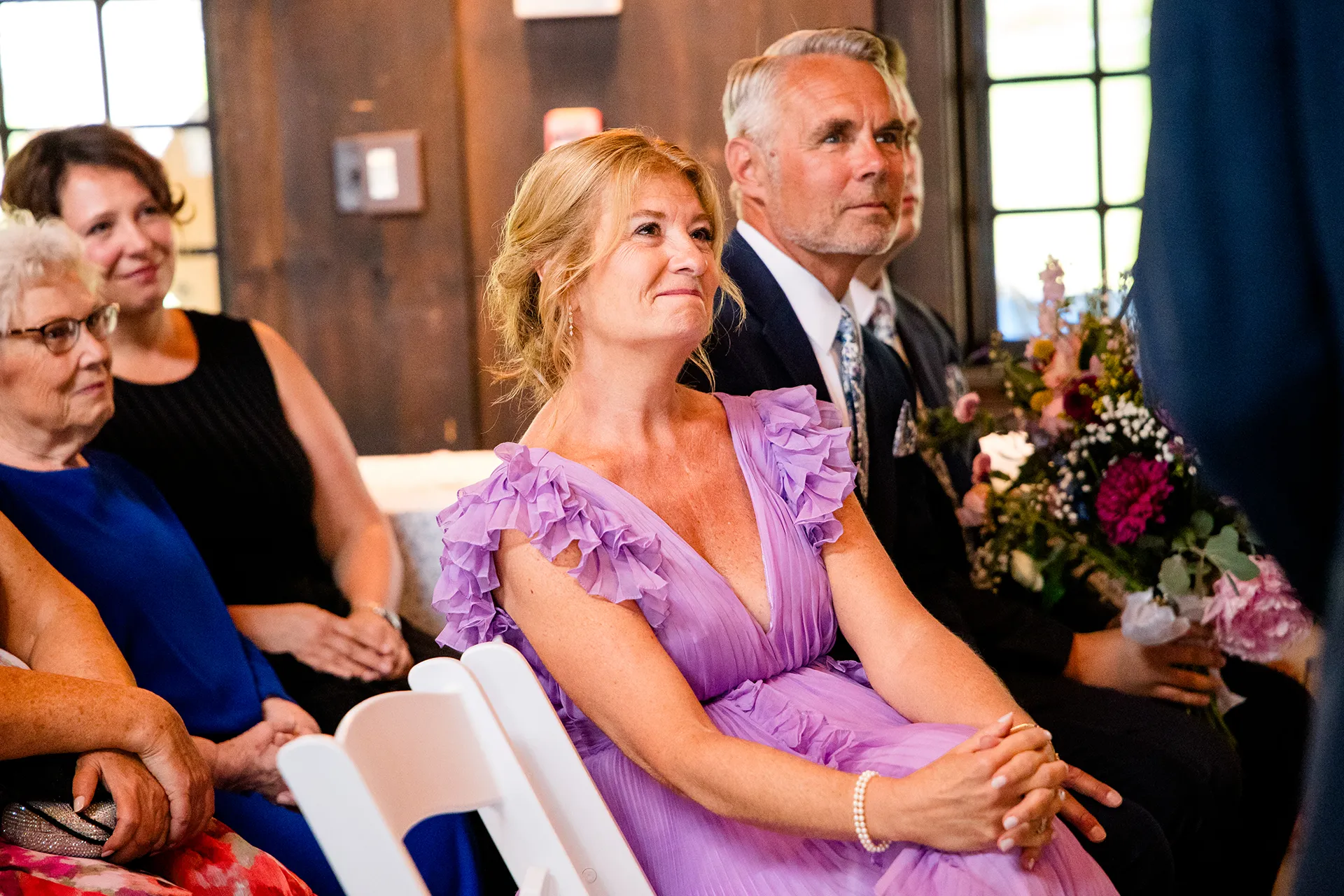 maine wedding photography bethany mike 29 A mom smiles as she watches a bride and groom get married at York Harbor Reading Room in York, Maine.