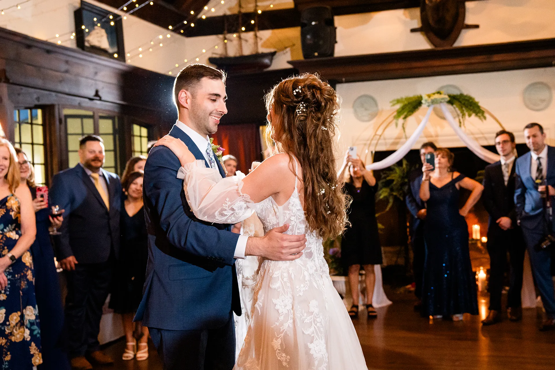 maine wedding photography bethany mike 36 A groom smiles at a bride as they share a first dance during a wedding reception at the York Harbor Reading Room in York, Maine.