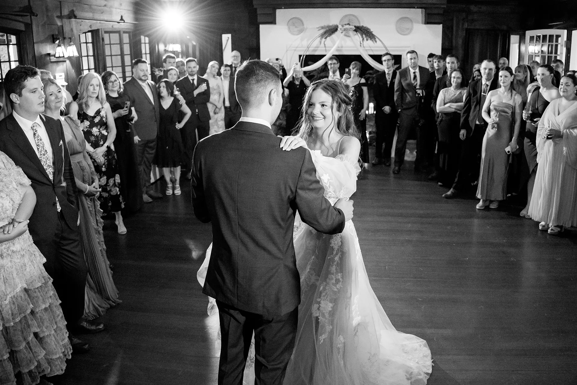 maine wedding photography bethany mike 38 A bride smiles at a groom as they dance during a wedding reception at the York Harbor Reading Room in York, Maine.