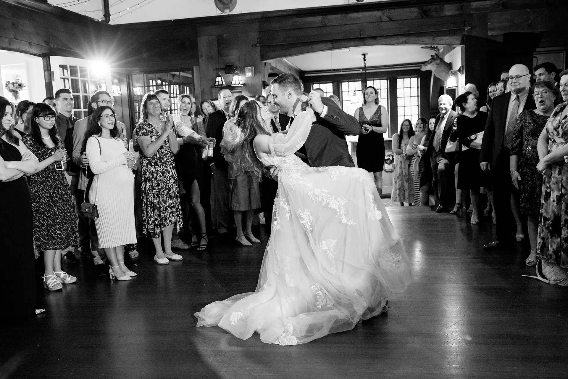 maine wedding photography bethany mike 39 A groom dips a bride as they smile during a wedding reception at the York Harbor Reading Room in York, Maine.