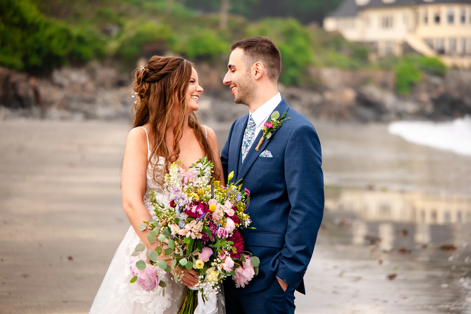 maine wedding photography bethany mike 45 A newly married smile at each other during wedding portraits on York Harbor Beach in York, Maine.