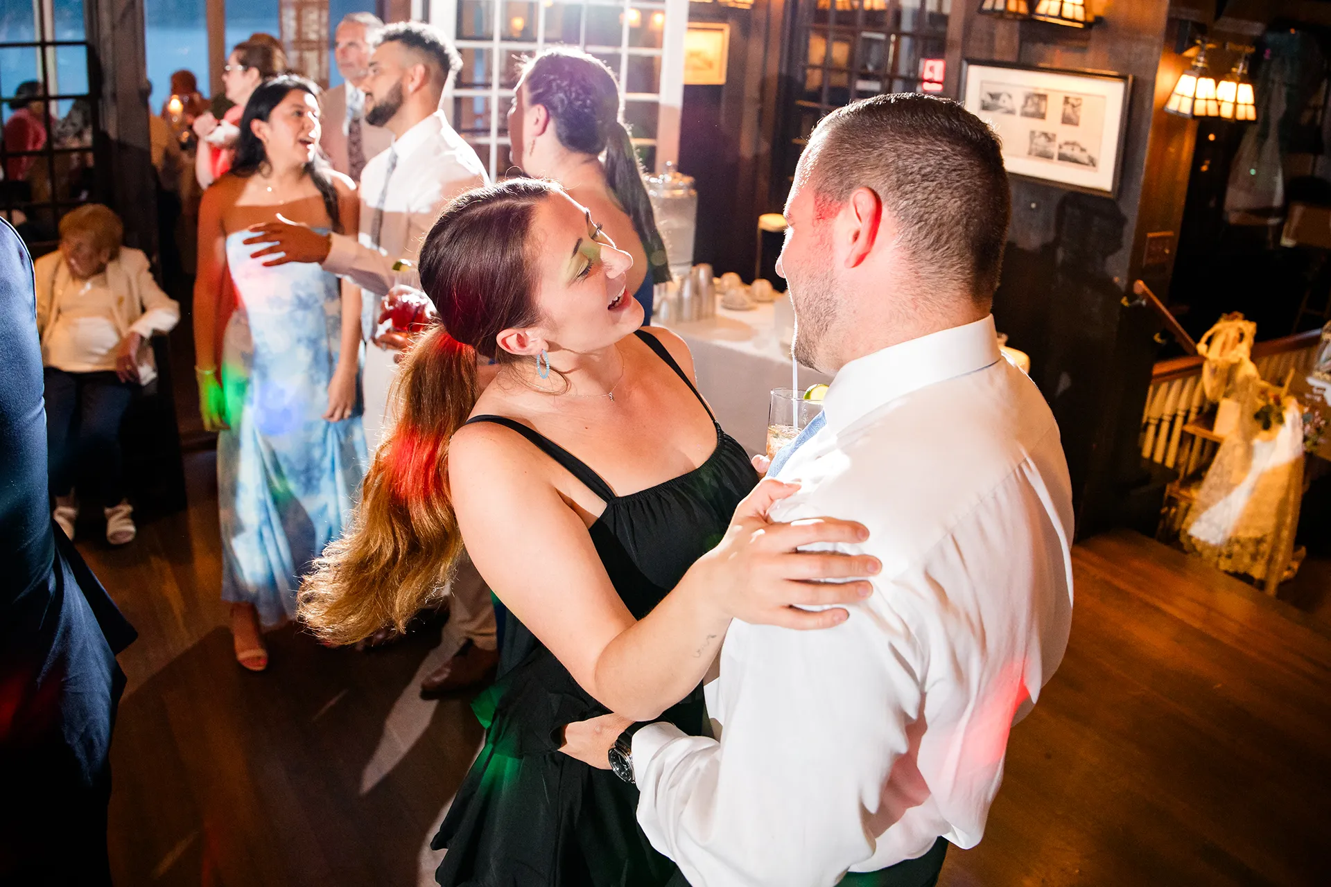 maine wedding photography bethany mike 63 A woman and man dance together during a wedding reception at the York Harbor Reading Room in York, Maine.