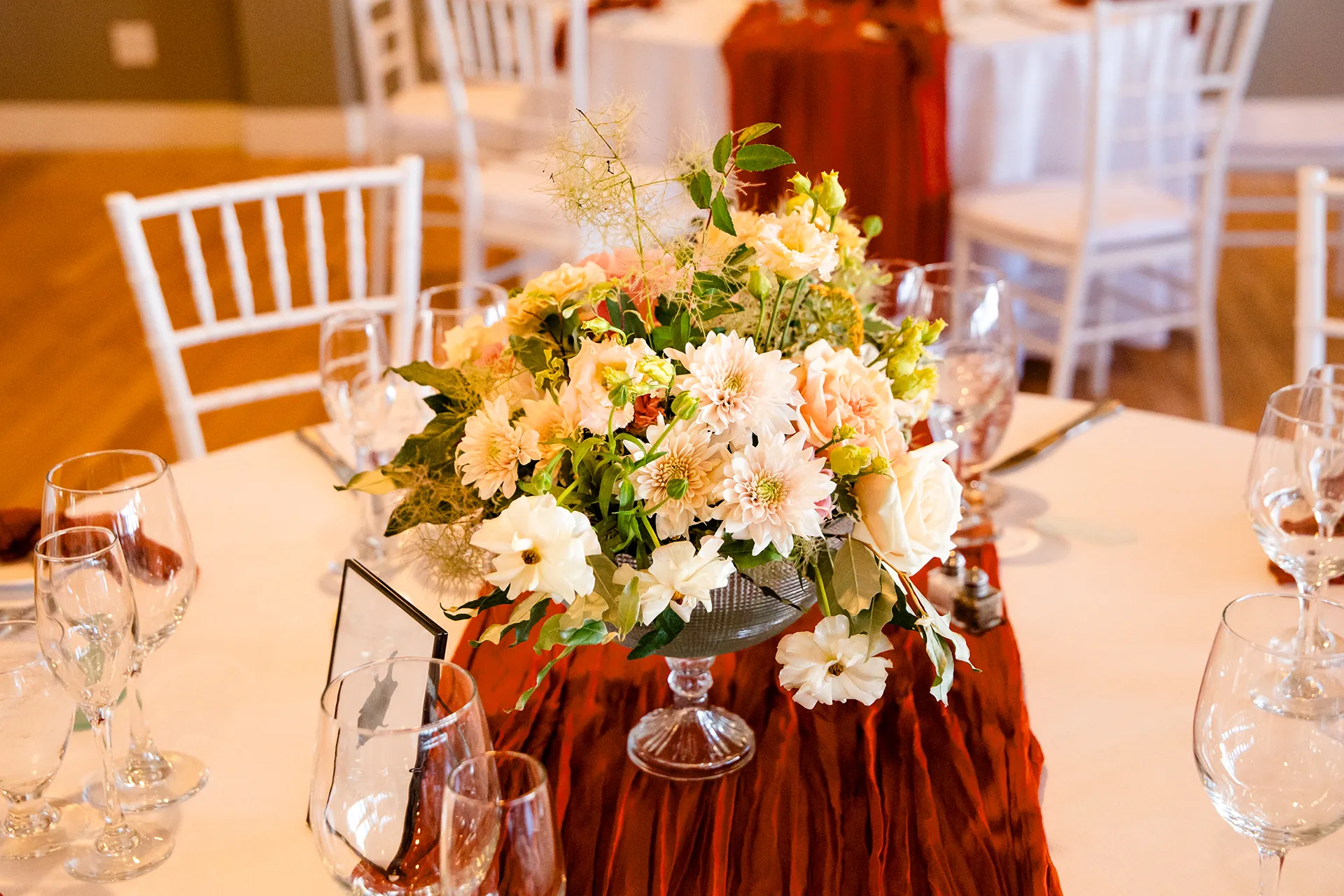 A closeup of a pastel floral centerpiece for a wedding reception at the Newagen Seaside Inn in Southport Maine.