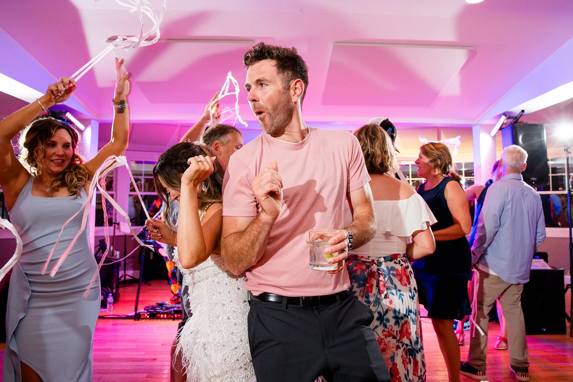 A man dances with a bride during a wedding reception at the Newagen Seaside Inn in Southport Maine.