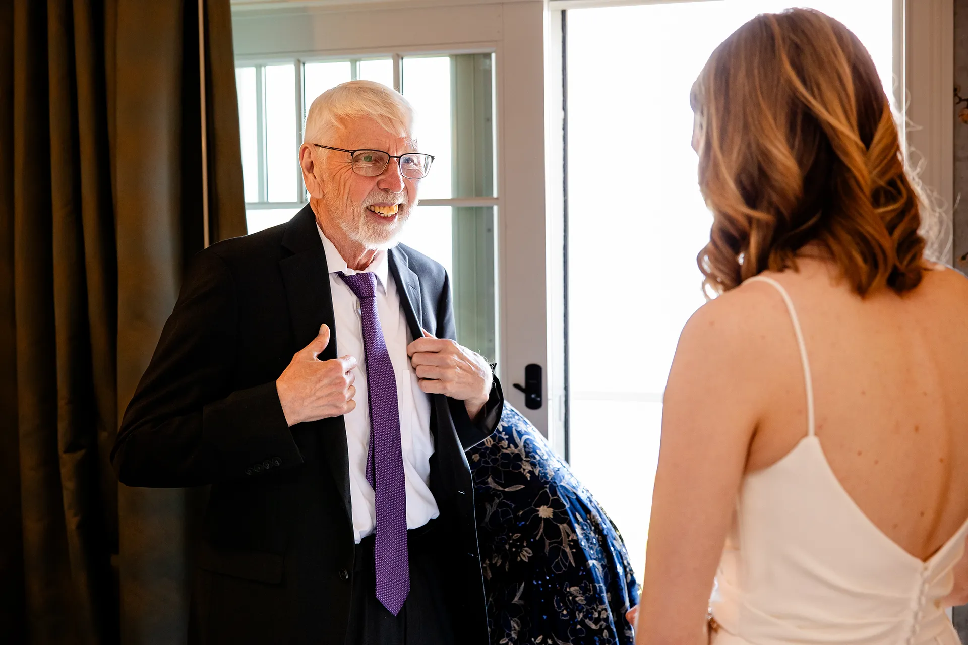 maine wedding photography caroline max 06 A dad smiles at a bride as she gets ready for a wedding at the Bar Harbor Inn and Spa in Bar Harbor, Maine.