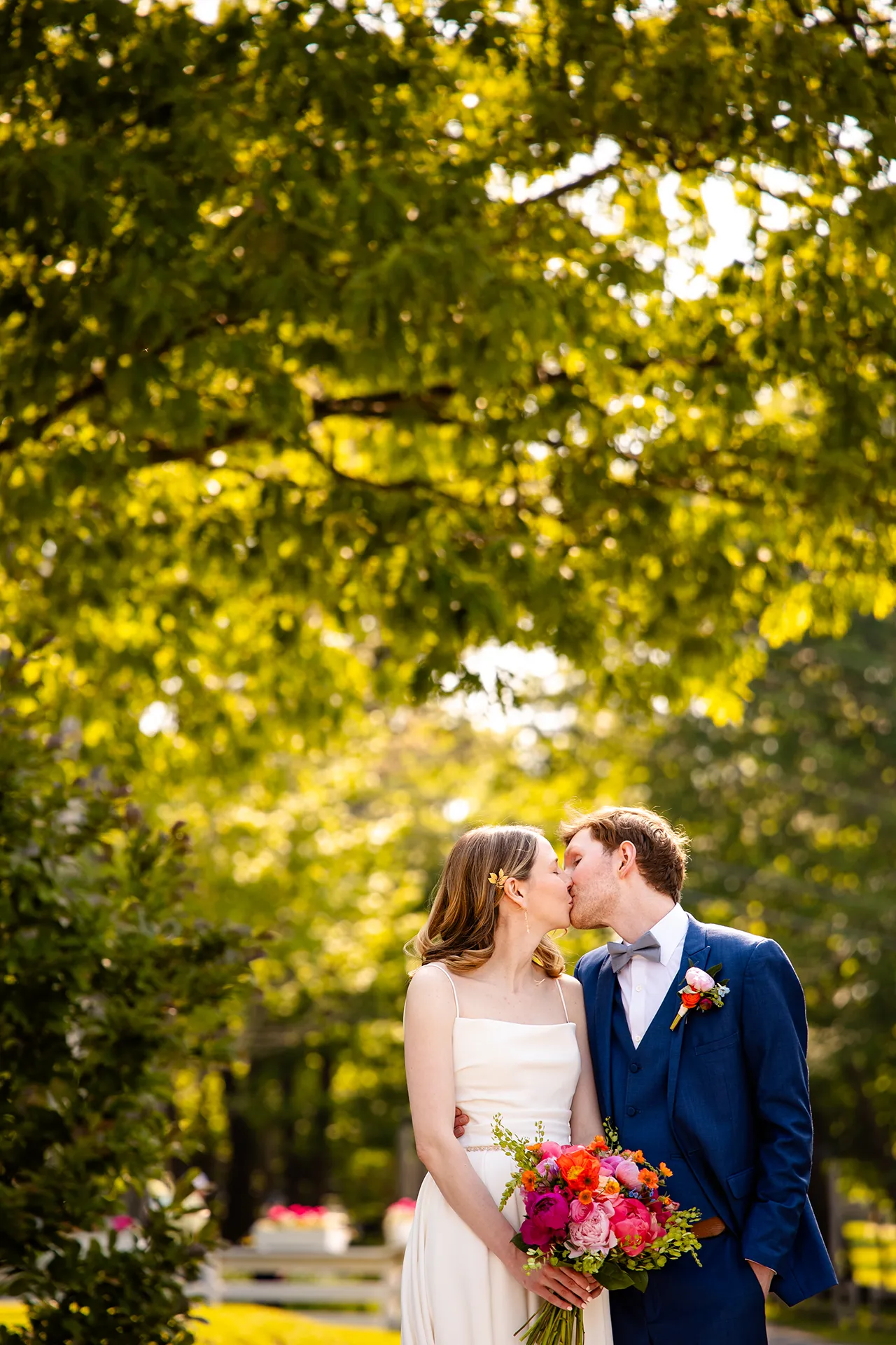 maine wedding photography caroline max 10 A bride and groom kiss in a garden at the Bar Harbor Inn and Spa in Bar Harbor, Maine.