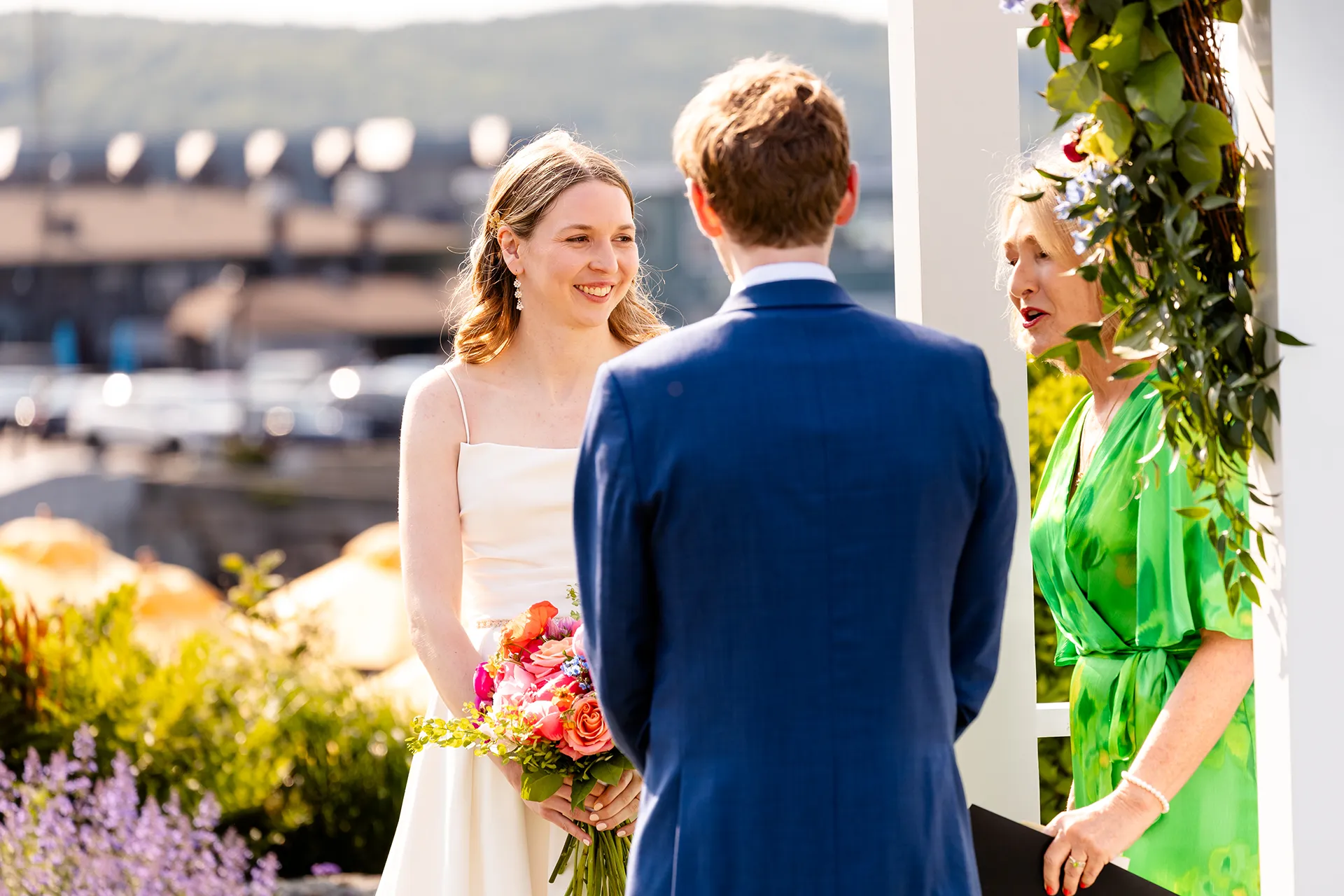 maine wedding photography caroline max 14 A bride smiles during a wedding ceremony at the Bar Harbor Inn and Spa in Bar Harbor, Maine.