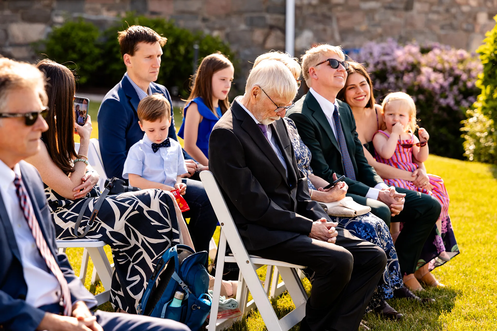 maine wedding photography caroline max 16 Wedding guests watch a ceremony at the Bar Harbor Inn and Spa in Bar Harbor, Maine.