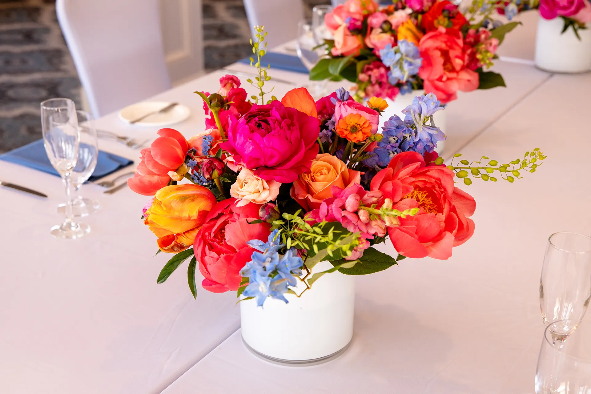 maine wedding photography caroline max 24 A closeup of a colorful centerpiece for a wedding reception in the Porcupine Room at the Bar Harbor Inn and Spa in Bar Harbor, Maine.