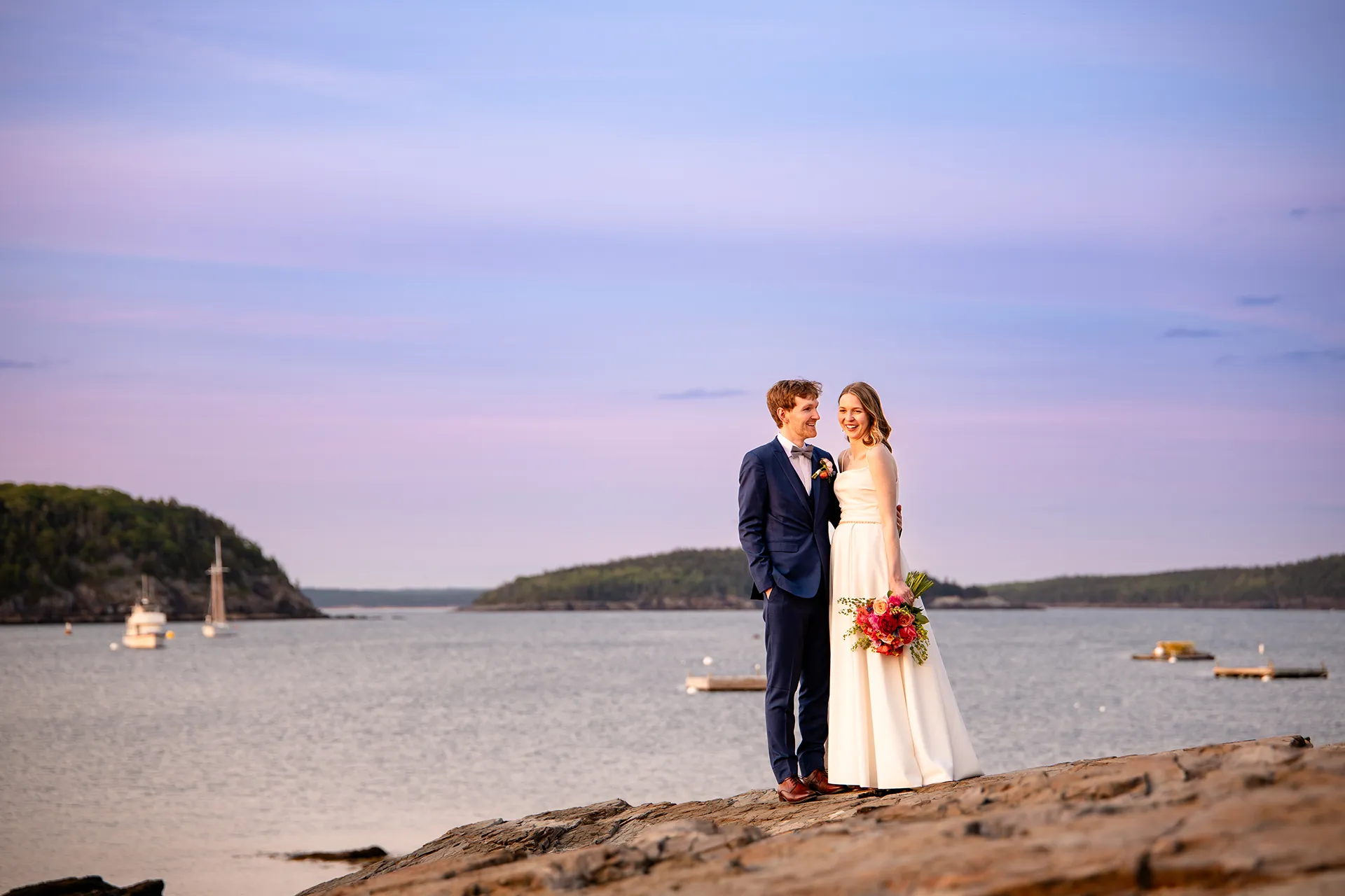 maine wedding photography caroline max 35 A bride and groom laugh together during wedding portraits at the Bar Harbor Inn and Spa in Bar Harbor, Maine.