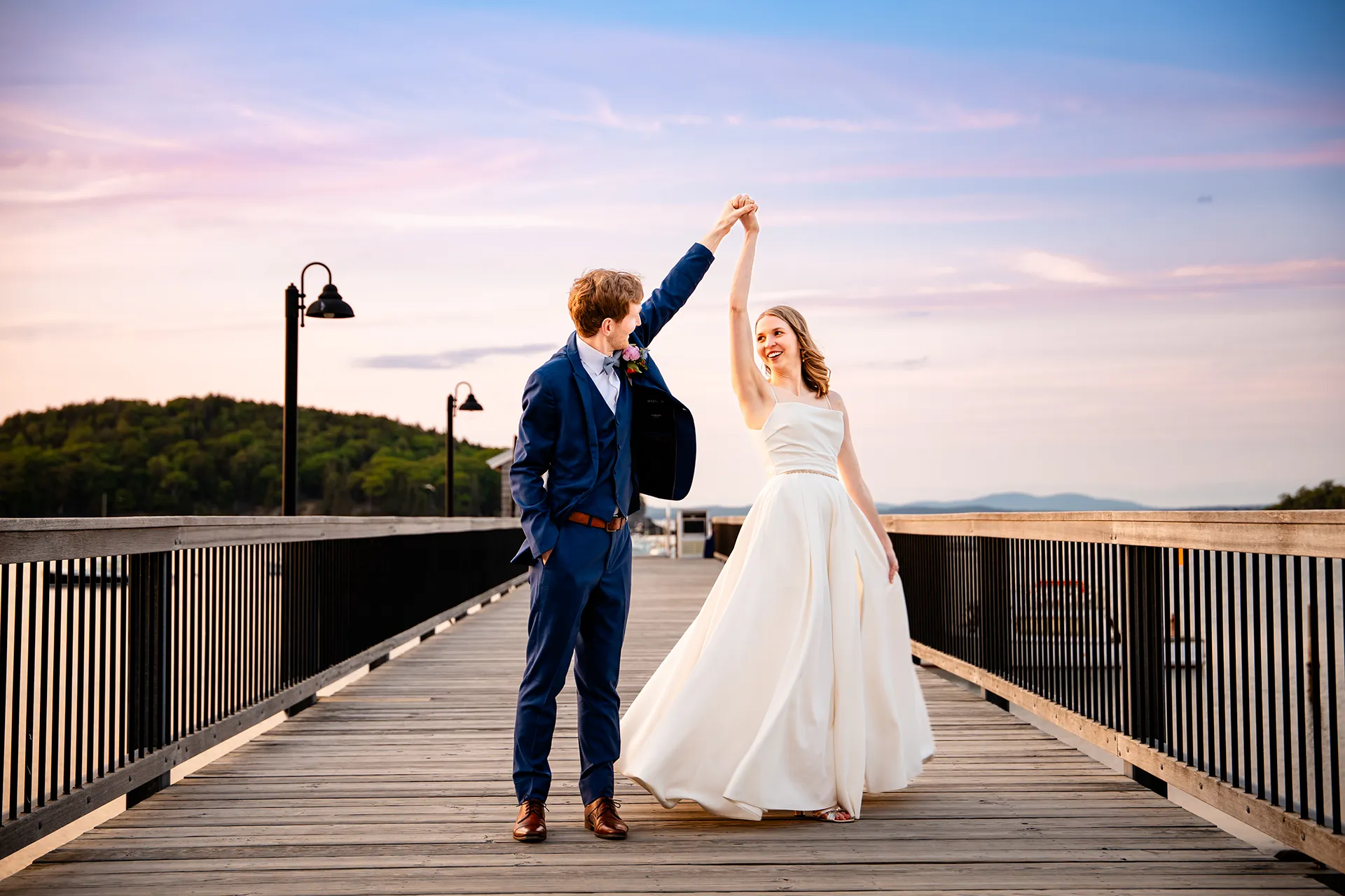 maine wedding photography caroline max 44 A groom spins a bride on a pier during wedding portraits at the Bar Harbor Inn and Spa in Bar Harbor, Maine.