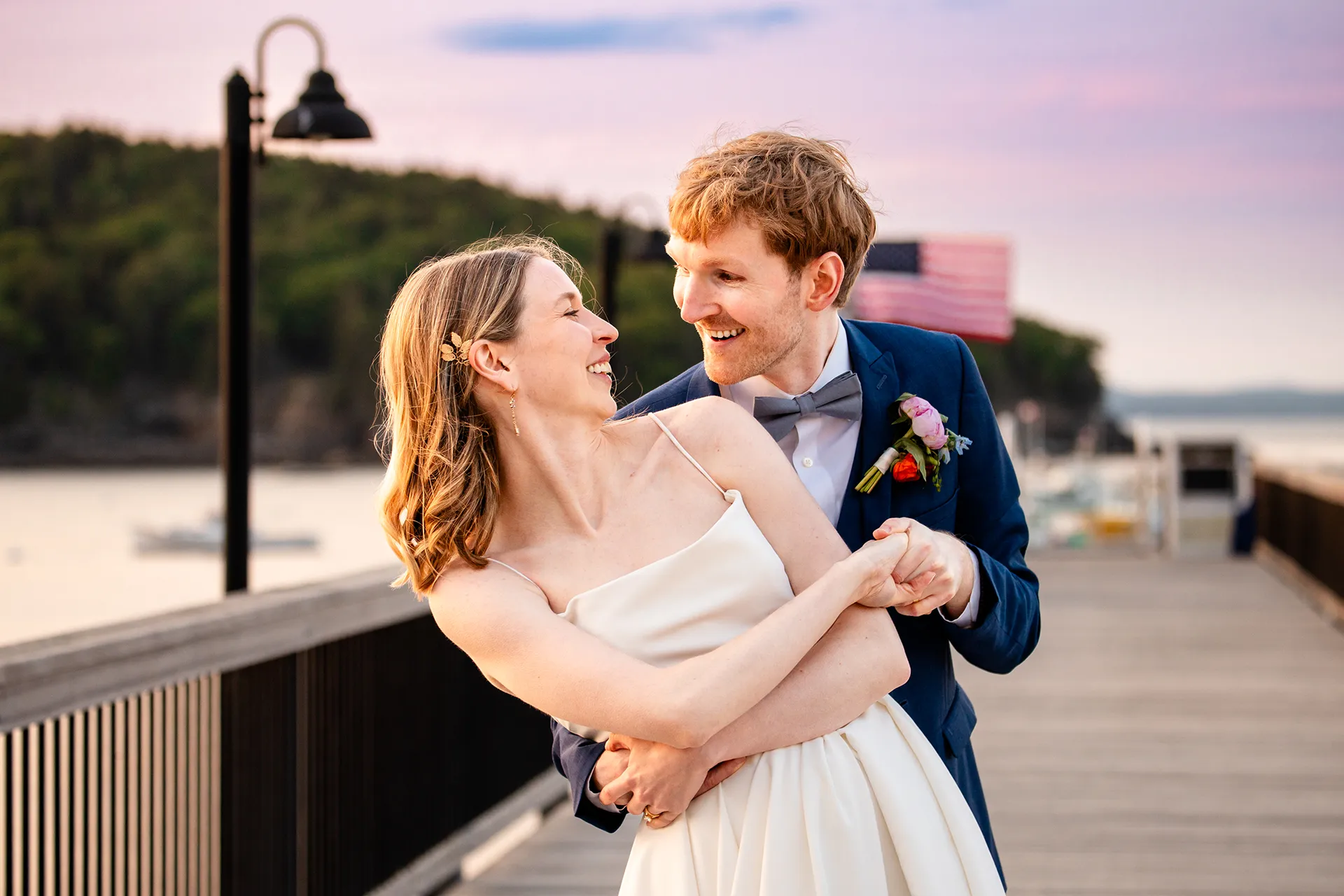 maine wedding photography caroline max 46 A groom dips a bride and smiles at her during wedding portraits at the Bar Harbor Inn and Spa in Bar Harbor, Maine.
