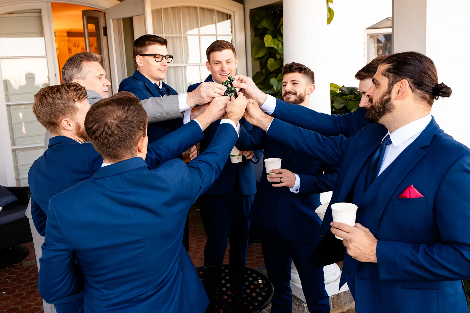 A groom toasts with groomsmen before a wedding at the Atlantic Oceanside Hotel & Event Center in Bar Harbor, Maine.