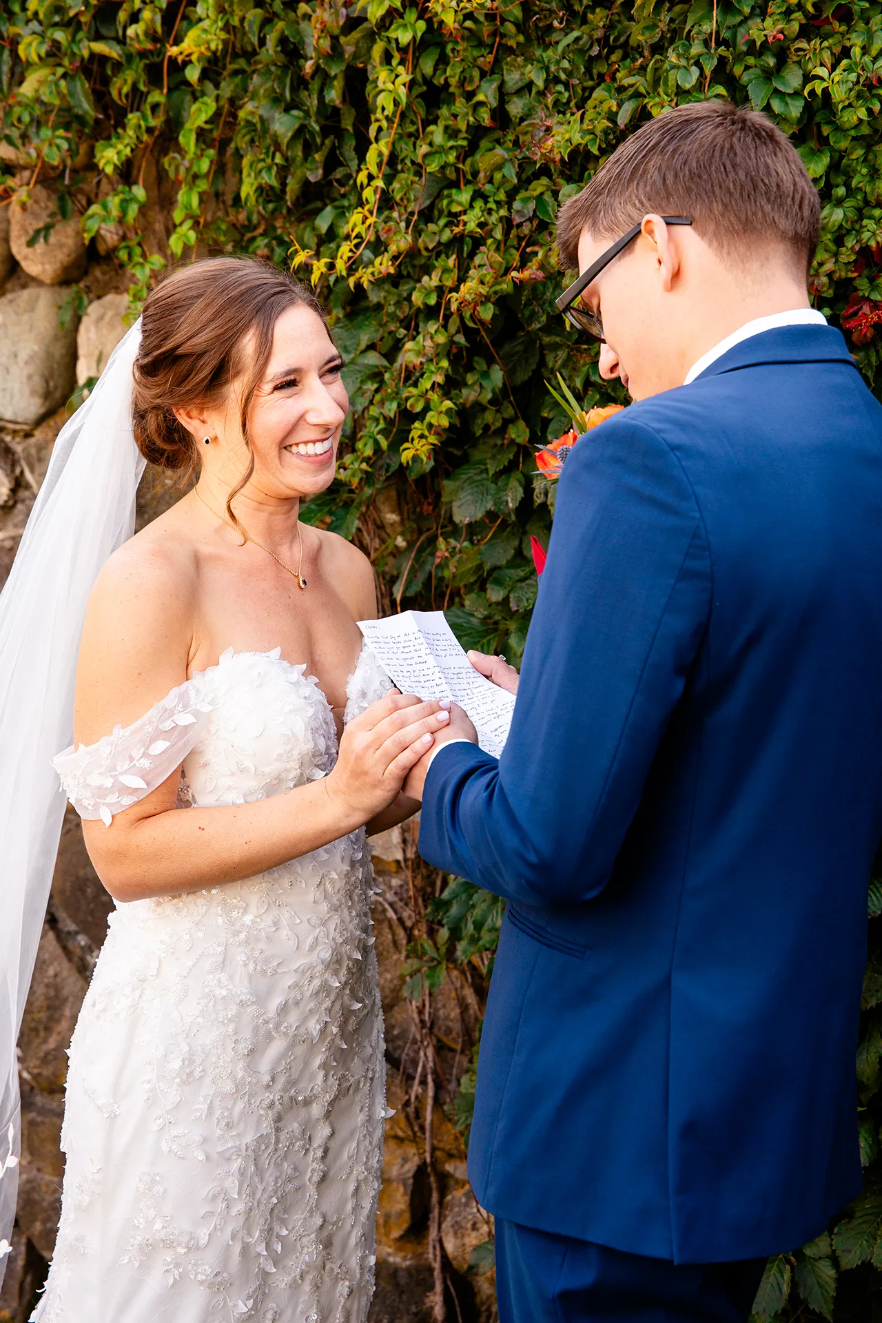 A groom shares his vows with a bride in the Willows' garden on the property of the Atlantic Oceanside Hotel & Event Center in Bar Harbor, Maine.