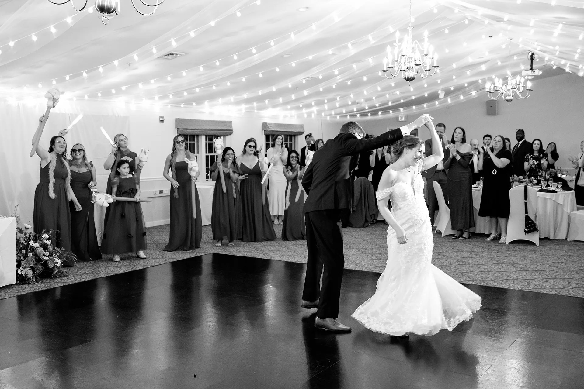 A groom spins a bride while guests cheer during a wedding reception at the Atlantic Oceanside Hotel & Event Center in Bar Harbor, Maine.