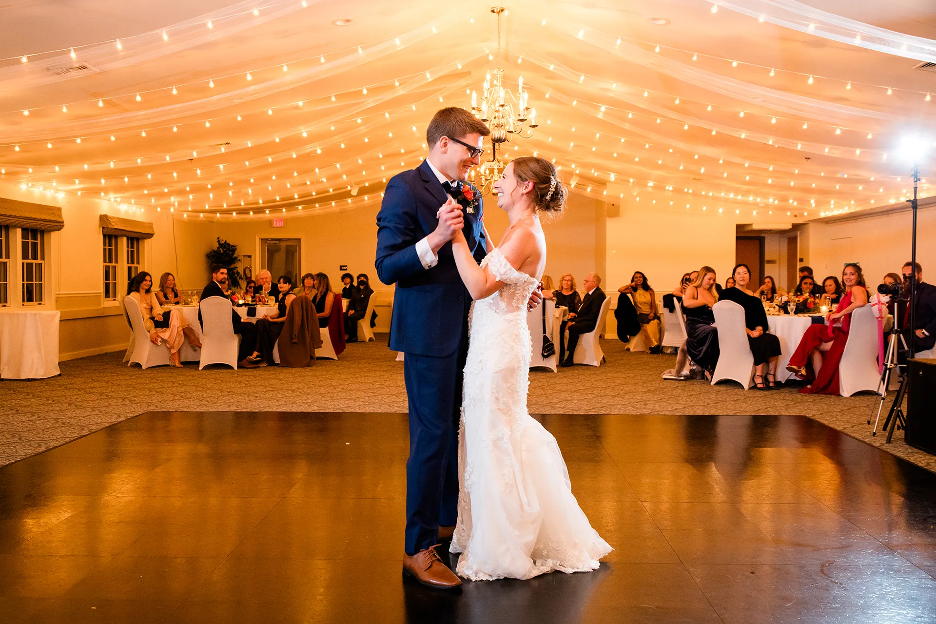 A bride and groom share a first dance during a wedding reception at the Atlantic Oceanside Hotel & Event Center in Bar Harbor, Maine.
