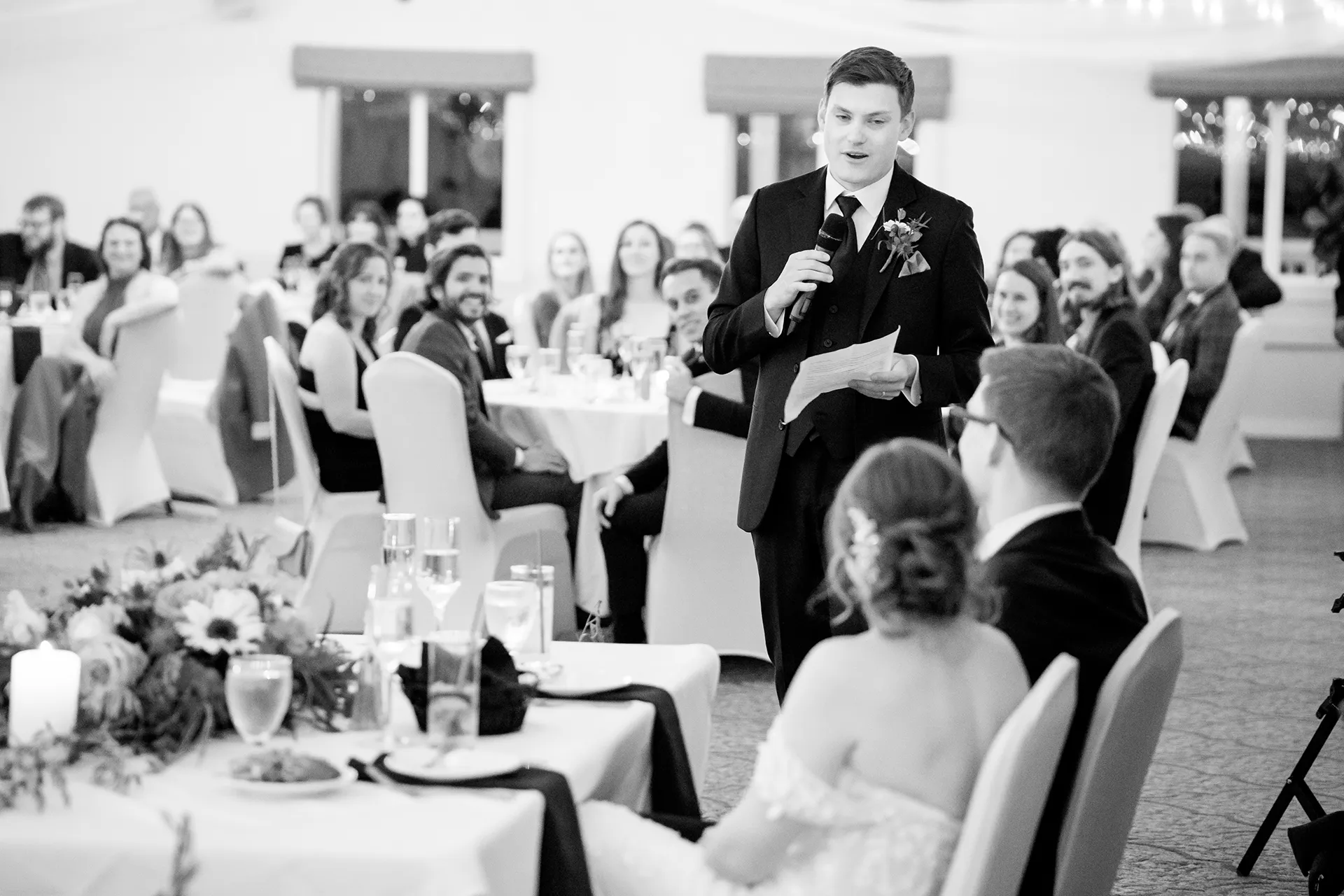 A groomsman give a toast during a wedding reception at the Atlantic Oceanside Hotel & Event Center in Bar Harbor, Maine.