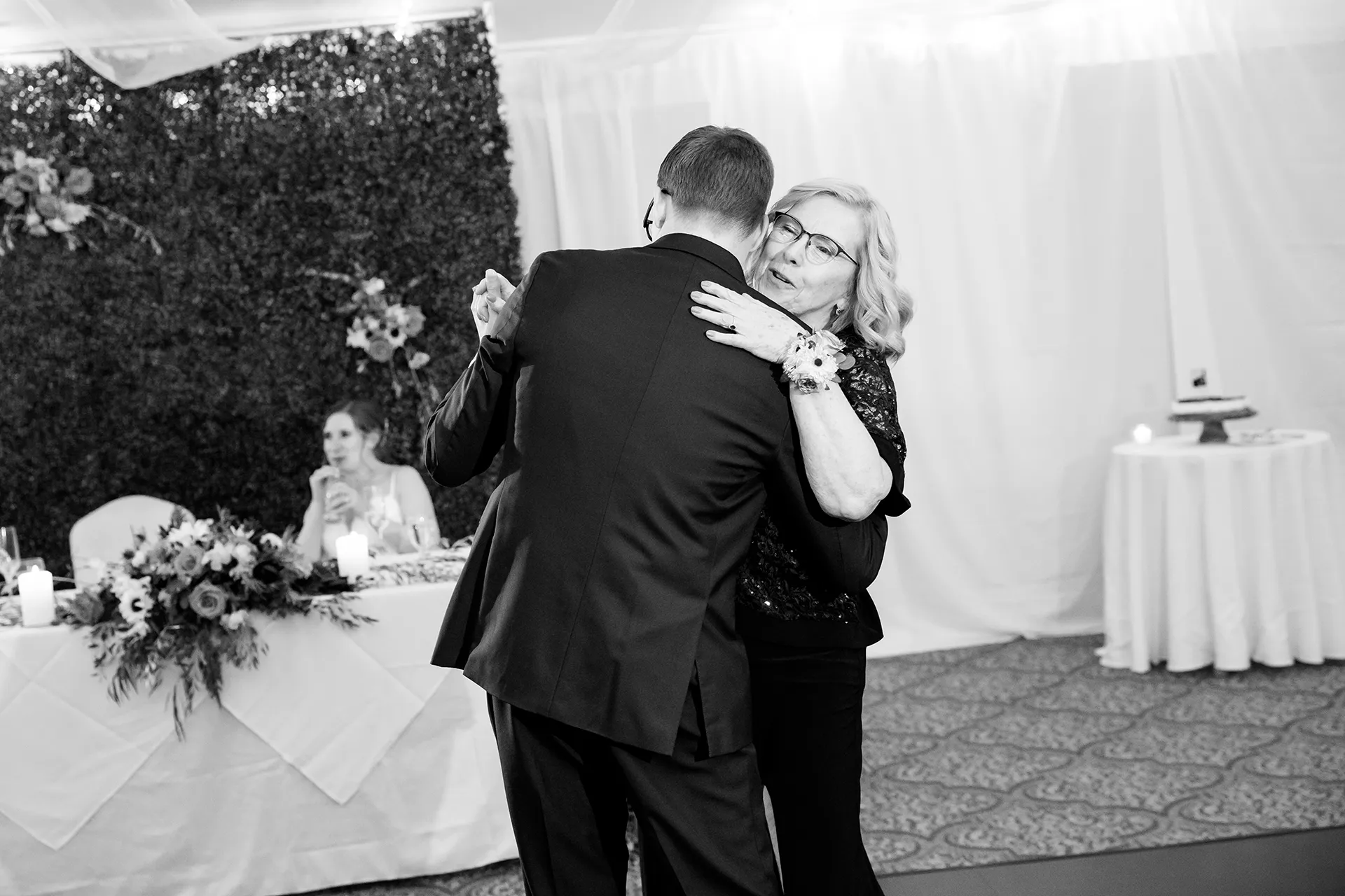 A groom and his mom share a dance during a wedding reception at the Atlantic Oceanside Hotel & Event Center in Bar Harbor, Maine.