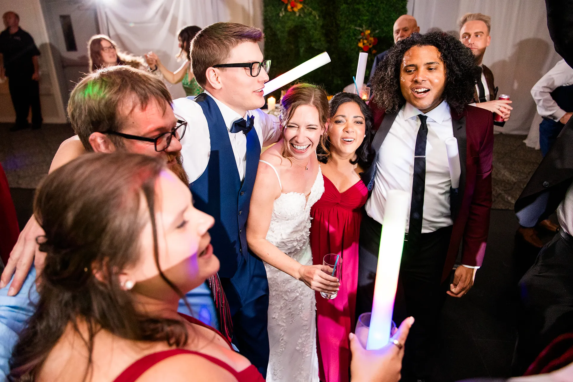 A bride and groom dance with guests during a wedding reception at the Atlantic Oceanside Hotel & Event Center in Bar Harbor, Maine.