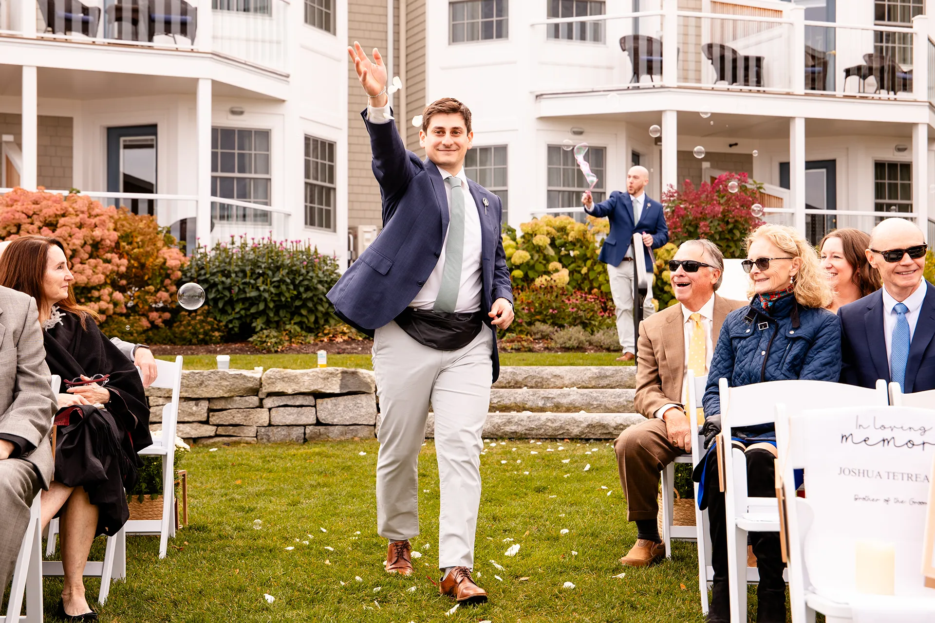 A groomsman throws flowers during a wedding ceremony at the Bar Harbor Inn and Spa near Acadia National Park in Maine.