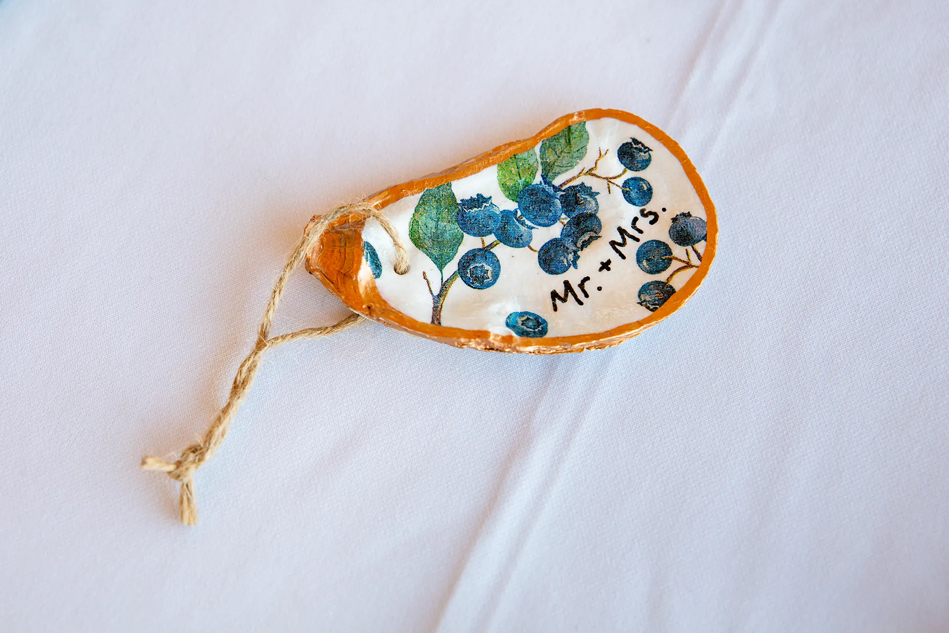 A closeup of a place card printed on a seashell at the Bar Harbor Inn and Spa near Acadia National Park in Maine.